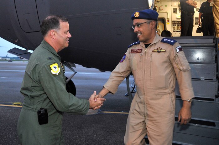 Col. Donald Shaffer greets Qatari Col. Mubarak Al-Binali after a Qatari C-17 landed at Charleston AFB Aug. 11. This is the first C-17 for the Qatari government. Air Mobility Command is providing a four-man military training team consisting of two instructor pilots and two instructor loadmasters who will help train the Qatar Emiri Air Force C-17 members throughout the next year.  Colonel Shaffer is the 437th Airlift Wing vice commander and Colonel Al-Binali is a pilot. (Air Force photo/James Bowman)