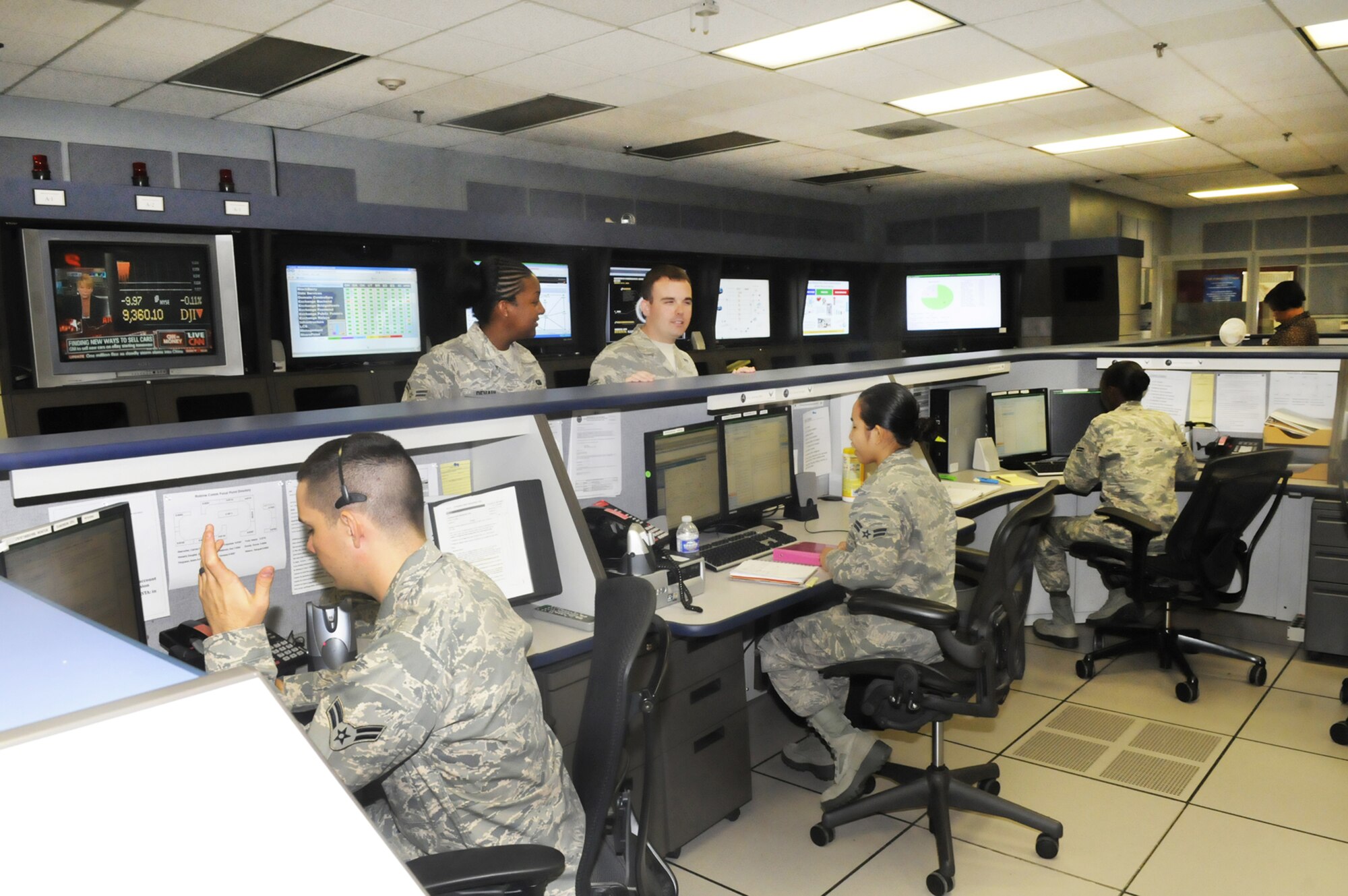 Airmen handle numerous queries in the 78th Communications Squadron help desk at Robins Air Force Base, Ga.  Recently, the 78th CS and the Information Technology Directorate there consolidated into the 78th Communications Directorate.  (U.S. Air Force photo/Sue Sapp)