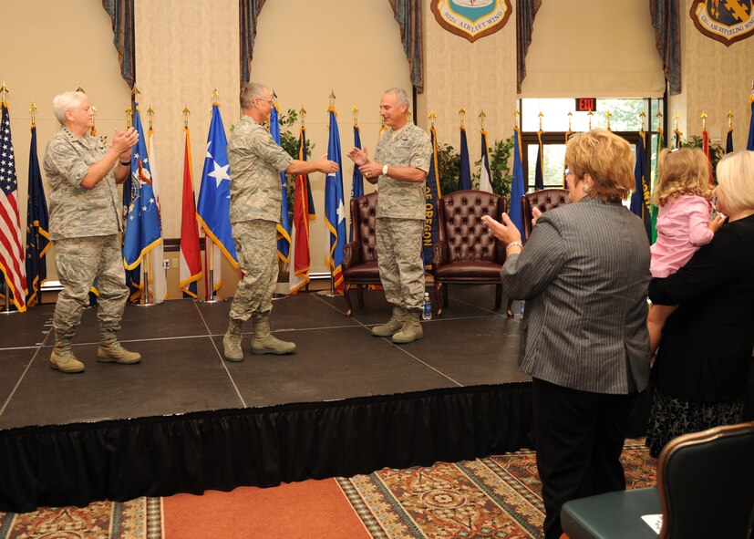 SCOTT AIR FORCE BASE, Ill. --Gen. Arthur J. Lichte, Air Mobility Command
commander (left), and Maj. Gen. Winfield W. Scott III, former 18th Air Force
commander (right), congratulate Lt. Gen. Robert R. Allardice for being named
the new 18th Air Force commander during a change-of-command ceremony at the
Scott Club on Aug. 19.  (U.S. Air Force photos by Airman 1st Class Wesley
Farnsworth)