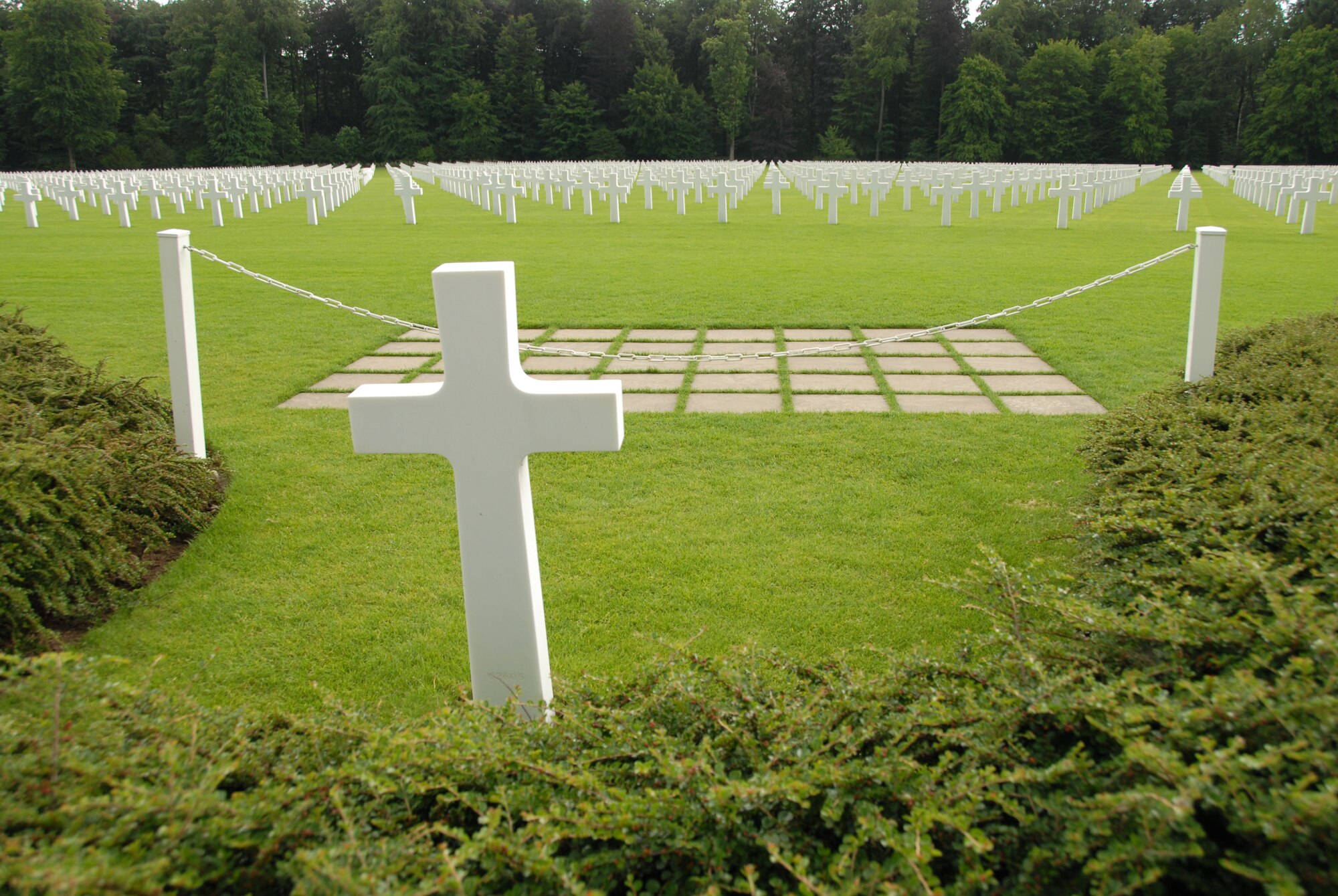 The final resting place of General George S. Patton, located in the Luxembourg American Cemetery and Memorial in Hamm,Luxembourg, overlooks the grave sites of many of the men he commanded during the Battle of the Bulge in World War II.  (Air National Guard Photo by Tech Sgt Kendra Owenby)

