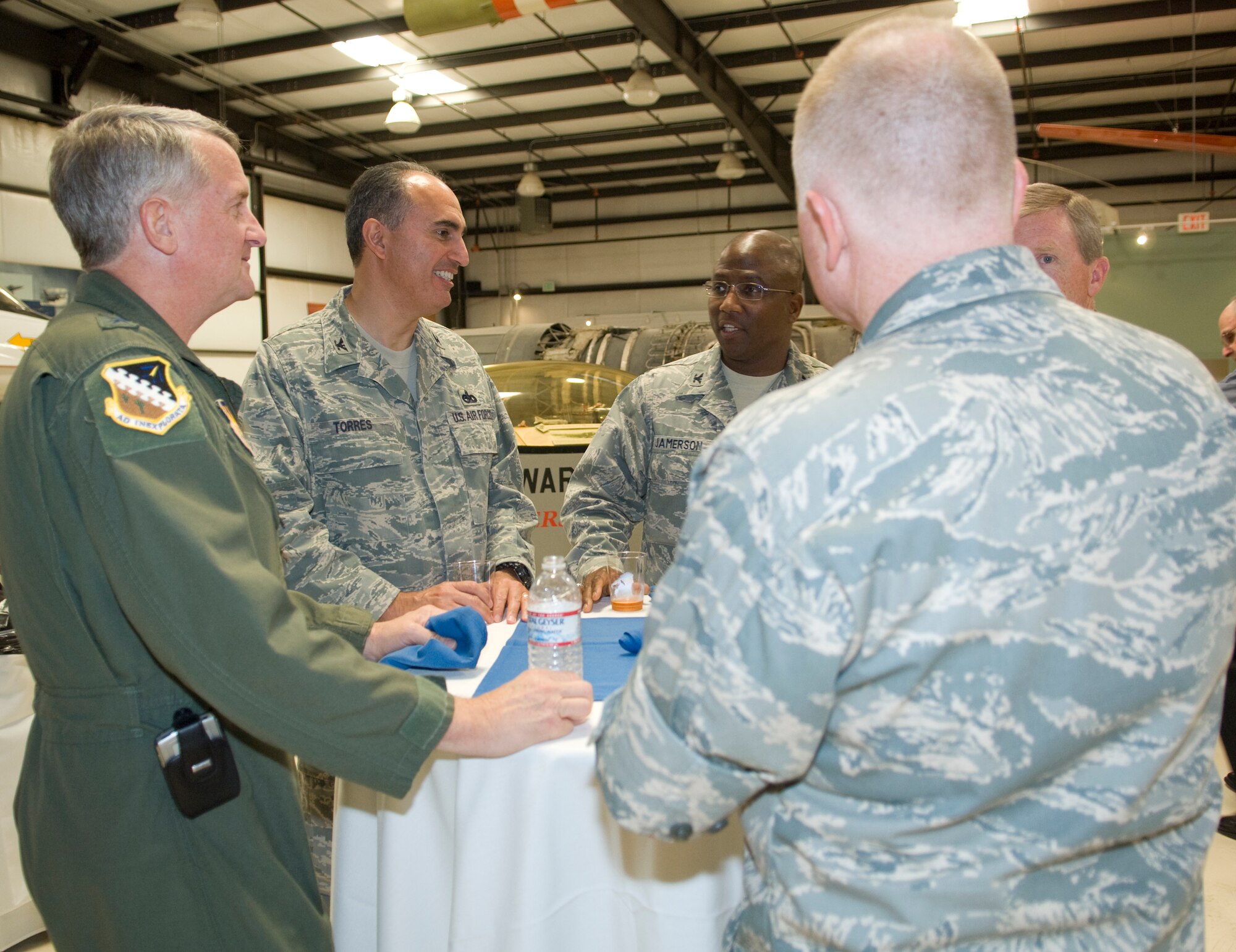 Maj. Gen. David Eichhorn (middle), Air Force Flight Test Center commander, Col. Jerry Gandy (right), 95th Air Base Wing commander and Col. Jose Torres, 95th ABW vice commander, talk with Col. Allen Jamerson, 72nd ABW commander from Tinker Air Force Base, Oklahoma city, Okla. During their two-day tour of Edwards, Tinker civic leaders visited various places around the base including the AFFTC museum and the NASA Dryden Flight Research Center. (Air Force photo/ Heather Anhalt)  