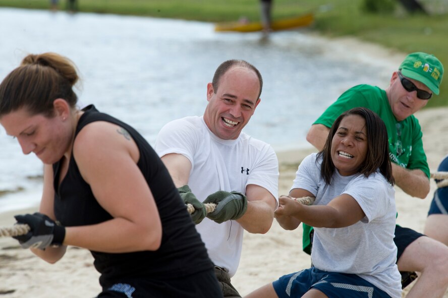 The 53d Wing staff team with the help of Col. Michael Gantt, 53rd Wing commander (middle), give it their all in the tug-o-war competition during the wing’s annual picnic at Eglin Air Force Base, Aug. 14.  The morning was filled with sports events followed by lunch and more games at Eglin’s Post’l Point.  (U.S. Air Force photo/Debbie Haussermann.)