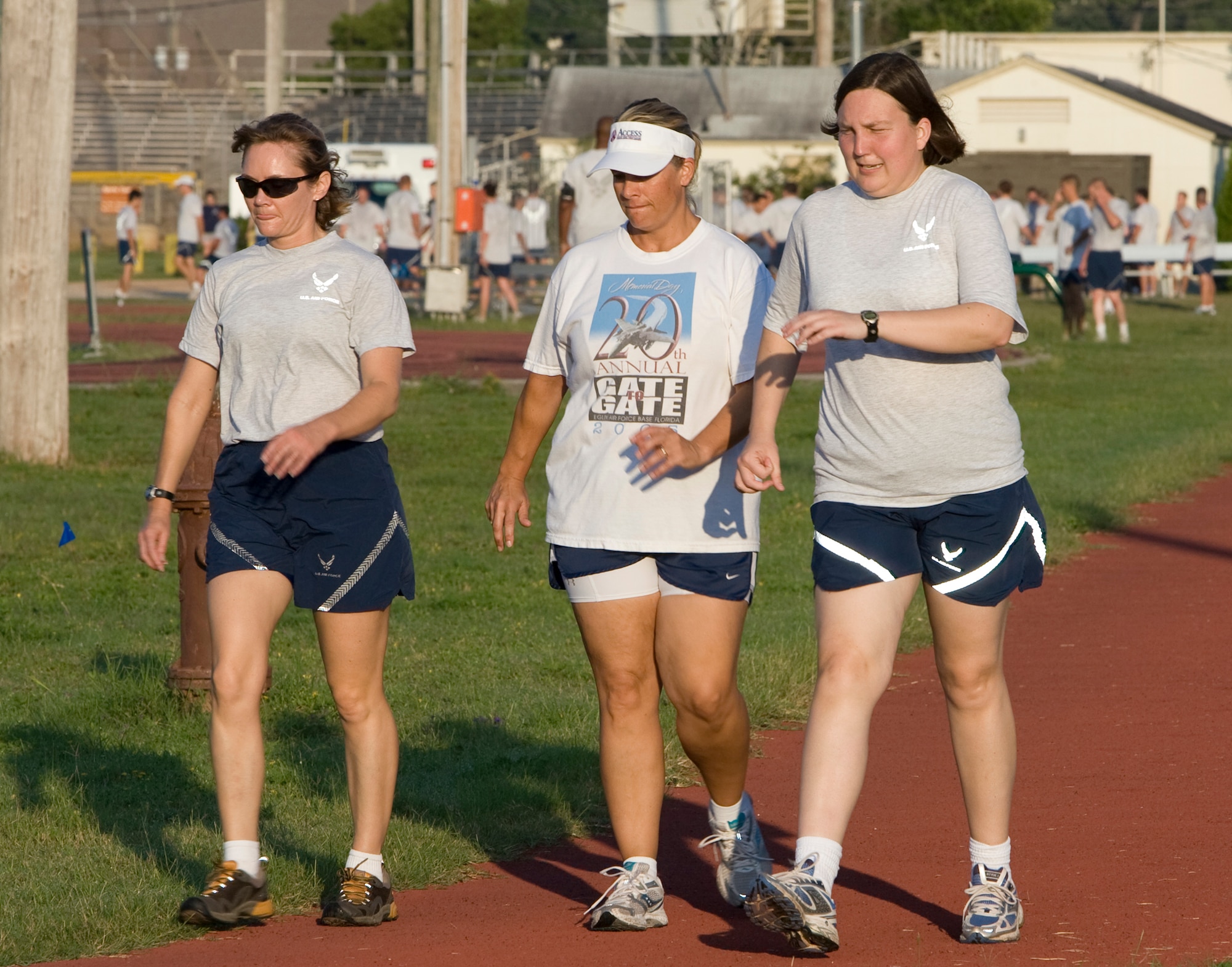 (Left to right) Master Sgt. Stefanie Riseden, Janice Busovne, honorary commander, and Maj. Sarah Hall, 68th Electronic Warfare Squadron, participate in the 5k run at the beginning of the 53rd Wing’s annual picnic at Eglin Air Force Base, Aug. 14.  The morning was filled with sports events followed by lunch and more games at Eglin’s Post’l Point.  (U.S. Air Force photo/Debbie Haussermann.)