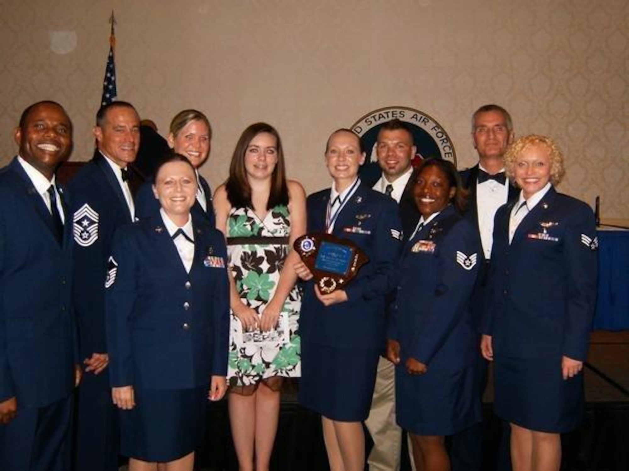 Members of the 315th Airlift Wing pose with family and wing leadership, during the Airman Leadership School graduation held at the Charleston Club.  Senior Airman Juanita Brown, 315th Aeromedical Evacuation Squadron was selected as a distinguished graduate. (courtesy photo) 