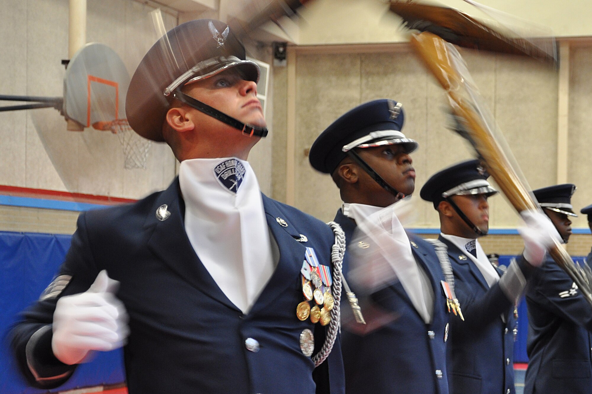 EGLIN AIR FORCE BASE, Fla. – The USAF Honor Guard Drill Team performs for spectators at the Child Development Center here, Aug. 17. The 16-person team performed professionally choreographed sequence of weapon maneuvers, precise tosses, complex weapon exchanges and a walk through the gauntlet of spinning, 11-pound M-1 Garande rifles with fixed bayonets. The Drill Team is the traveling component of the USAF Honor Guard that promotes Air Force awareness among military and civilian audiences through their routines. (U.S. Air Force photo/ Airman Anthony Jennings)