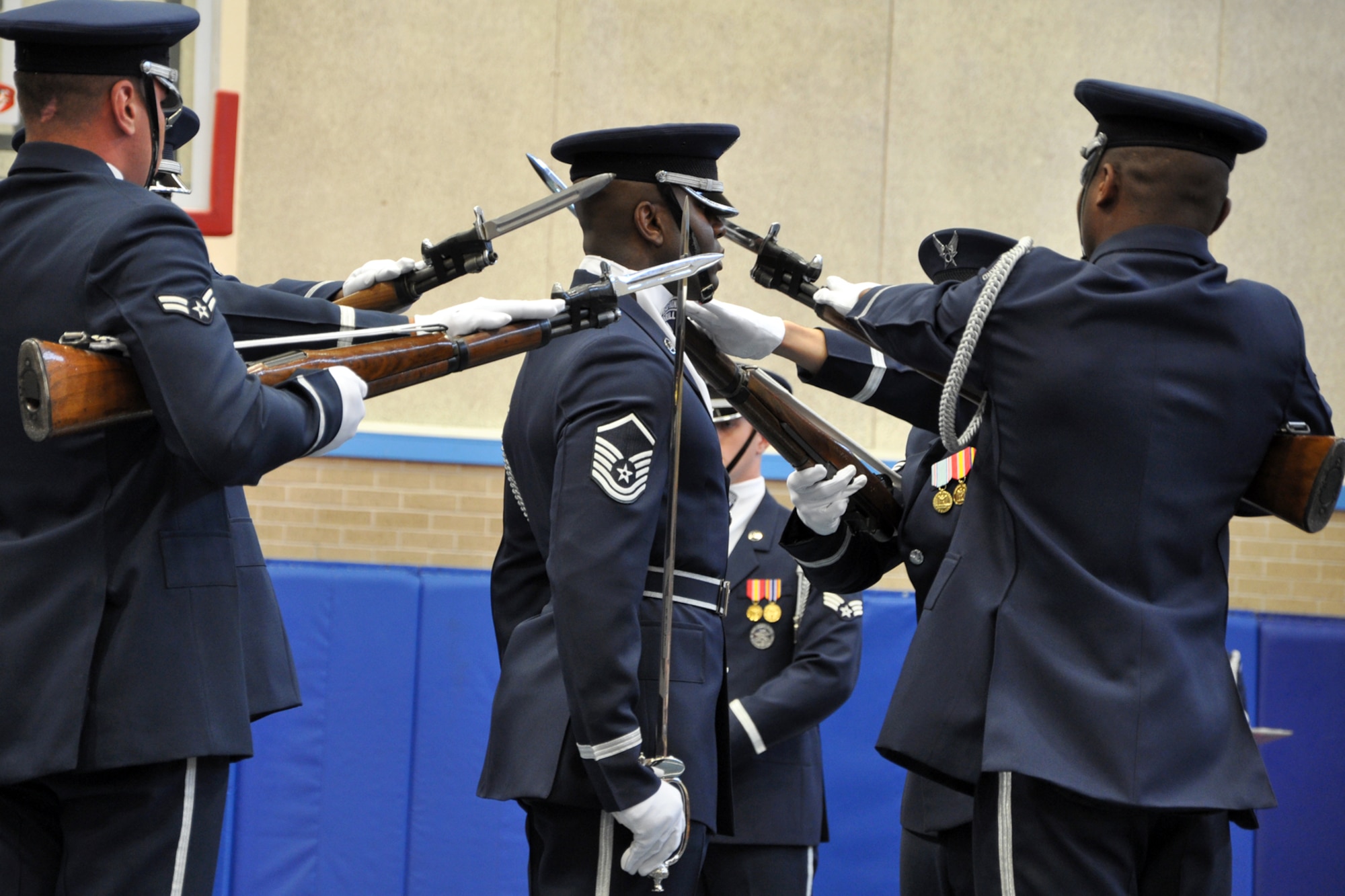 EGLIN AIR FORCE BASE, Fla. – The USAF Honor Guard Drill Team showcases a four-person performance centered on a stationary drill flight chief, flanked by four team members, at the Child Development Center here, Aug. 17. The Drill team made Eglin their first stop during the Fla. Tour, performing complex drill routines for Team Eglin. The Drill Team is the traveling component of the USAF Honor Guard that promotes Air Force awareness among military and civilian audiences through their routines. (U.S. Air Force photo/ Airman Anthony Jennings)
