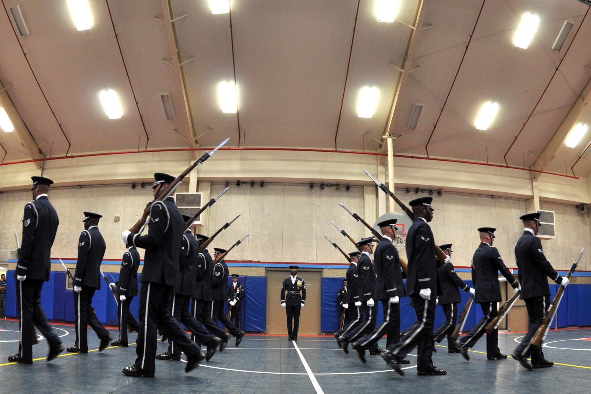 EGLIN AIR FORCE BASE, Fla. – The USAF Honor Guard Drill Team performs for spectators at the Child Development Center here, Aug. 17. The 16-person team performed professionally choreographed sequence of weapon maneuvers, precise tosses, complex weapon exchanges and a walk through the gauntlet of spinning, 11-pound M-1 Garande rifles with fixed bayonets. The Drill Team is the traveling component of the USAF Honor Guard that promotes Air Force awareness among military and civilian audiences through their routines. (U.S. Air Force photo/ Airman Anthony Jennings)