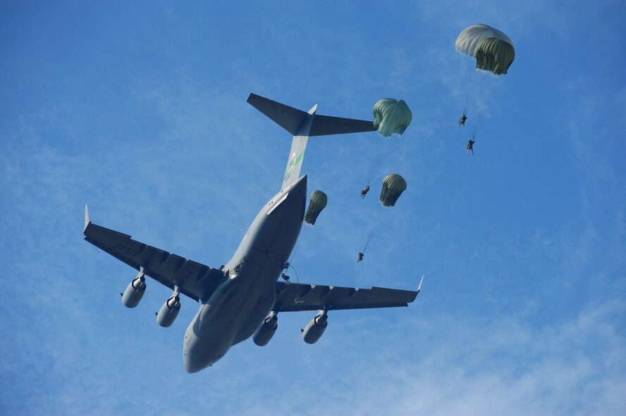 U.S. Army Rangers parachute from a C-17 Globemaster III from McChord Air Force Base, Wash., over Ft. Benning, Ga., Aug. 3, 2009, during Ranger Rendezvous 2009. More than 1,000 Rangers assigned to four Ranger battalions from across the country participated in the mass tactical jump. (U.S. Air Force Photo/Senior Airman Jason Epley)