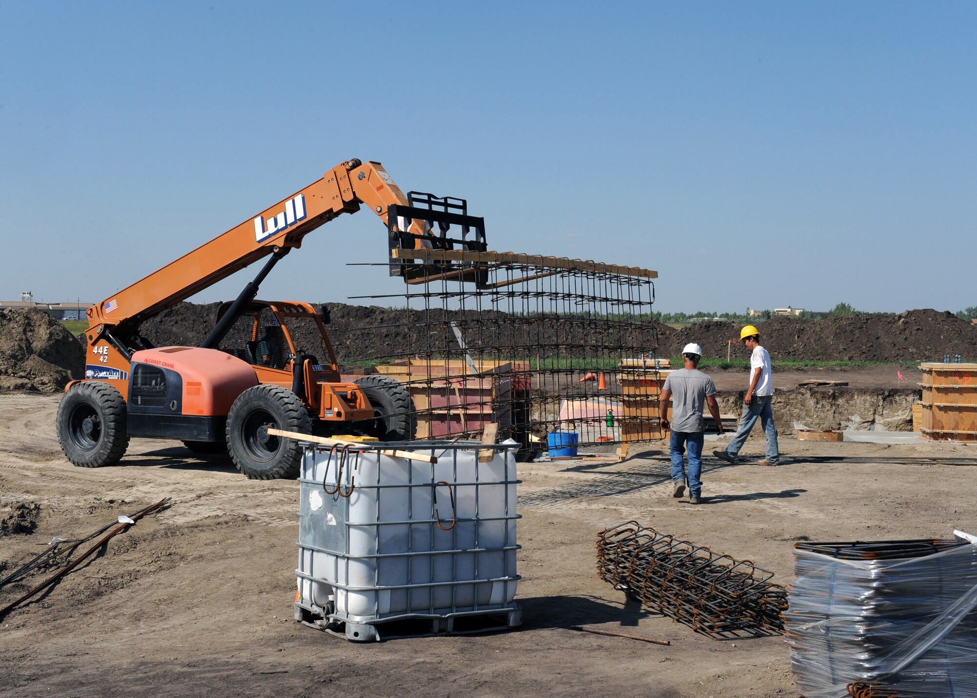 MINOT AIR FORCE BASE, N.D. -- Members of Telehey Construction Company move a wall of reinforcing bars to strengthen the foundation at a new radar site here, Aug. 11. The digital airport surveillance radar, or DASR-11 program, is expected to be completed in April of 2010. The DASR-11 will be able to track, discern between military and civilian aircraft in and around the city of Minot.  (U.S. Air Force photo by Staff Sgt. Keith Ballard)