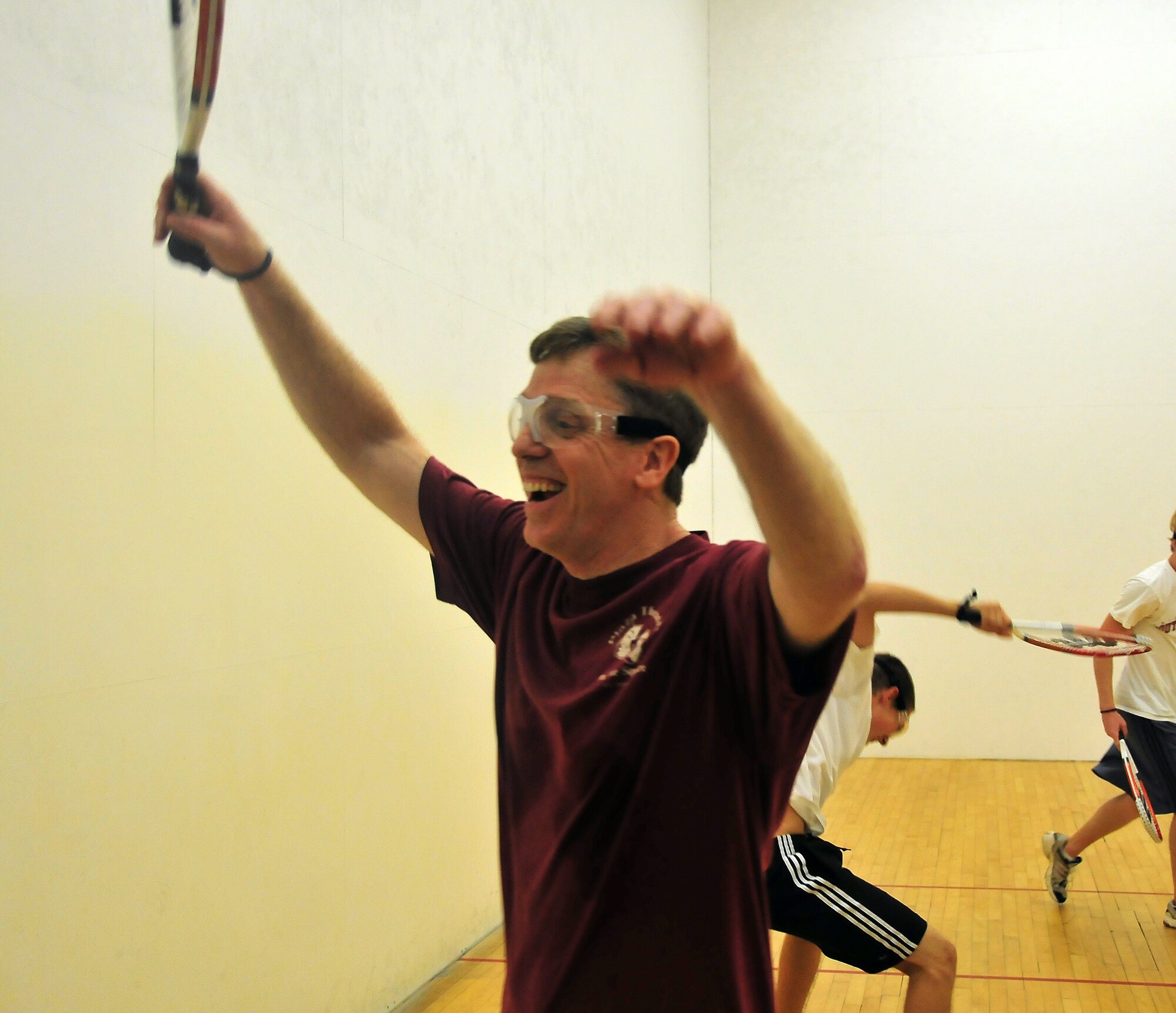 J.R. Nobel celebrates a victory over the opposing team after winning three out of five matches of racquetball, taking the game at the Fitness and Sports Center here Aug. 14. Each match lasted to 15 points, and whicever team reached 15 points first, won the match. Nobel is a retired master sergeant. (U.S. Air Force photo/Staff Sgt. Daniel Bowles)