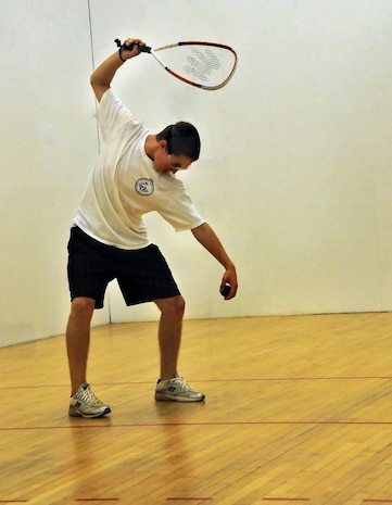 Austin Fields, 16, prepares to serve the ball during an afternoon game of racquetball at the Fitness and Sports Center here Aug. 14. Racquetball courts are open during regular fitness center hours for reserve, open and challenge play. Fields is the son of Master Sgt. Leland Fields, a loadmaster superintendent with the 437th Operations Group. (U.S. Air Force photo/Staff Sgt. Daniel Bowles)