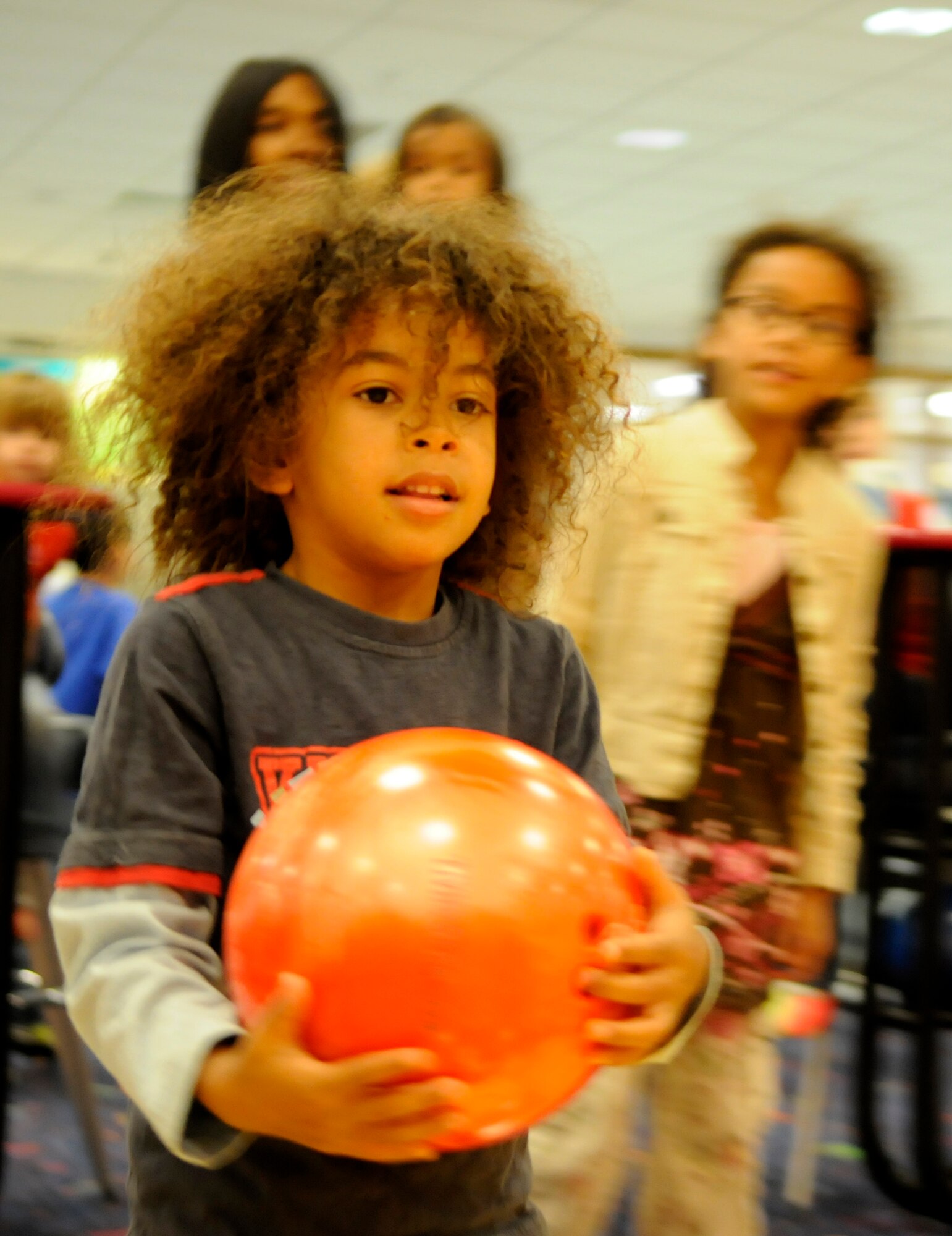 RAF MILDENHALL, England -- Rockie Henriquez, son of Master Sgt. Erasmus Henriquez, 352nd Special Operations Group, gets ready to bowl during a celebration for all the children who completed the summer reading program Aug. 15.  The program required children to read 10 books or 10 hours over the summer.  (U.S. Air Force photo by Staff Sgt. Christopher L. Ingersoll)
