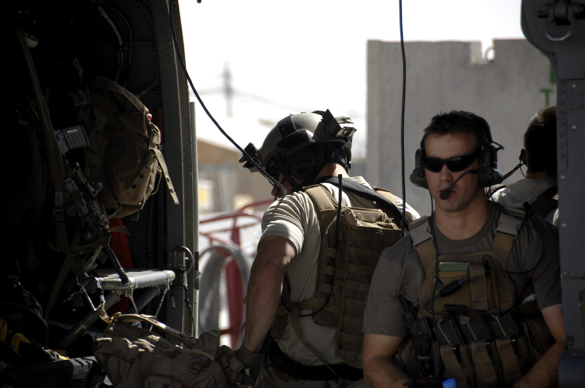 One rescue team heads to the helicopter to respond to a medical emergency down range here Aug. 12.  The primary mission of the 129th Rescue Squadron’s HH-60G Pave Hawk helicopter is to conduct day or night combat search and rescue operations into hostile environments to recover downed aircrew or other personnel during war.  (U.S. Air Force photo/Senior Airman Timothy Taylor)