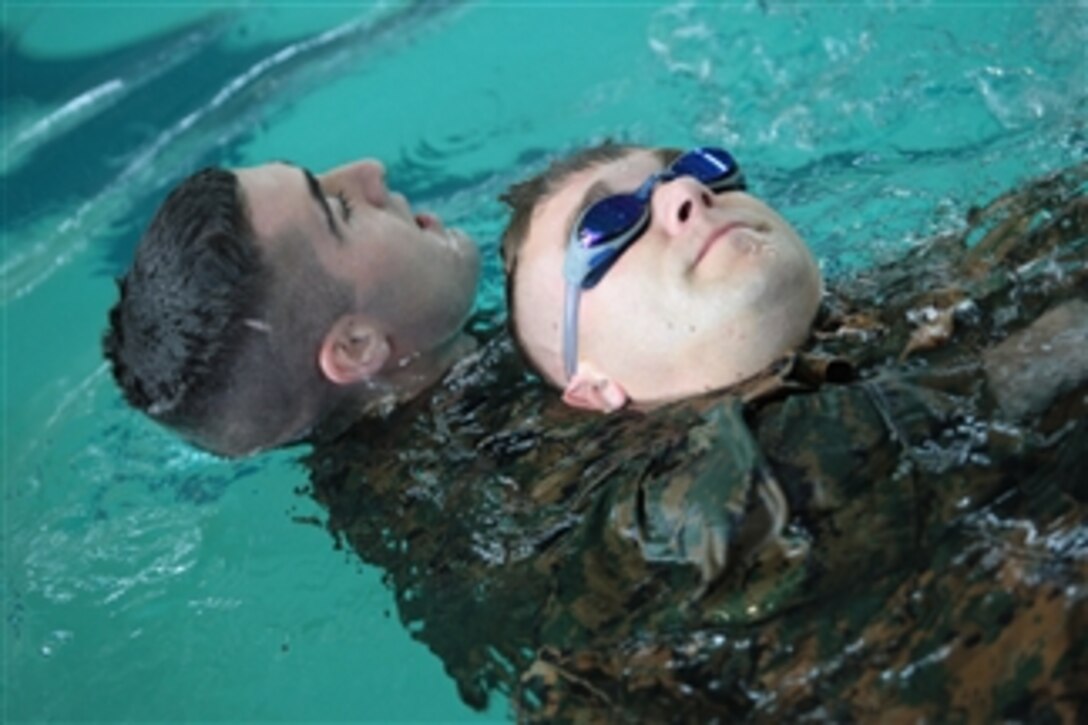 U.S. Marines from Marine Forces Reserve participate in a swim qualification held at the Tulane University pool in New Orleans, La., on Aug. 13, 2009.  Swim qualification is an annual training event used to reduce fear of the water, raise self confidence, and develop an ability to survive in water.  