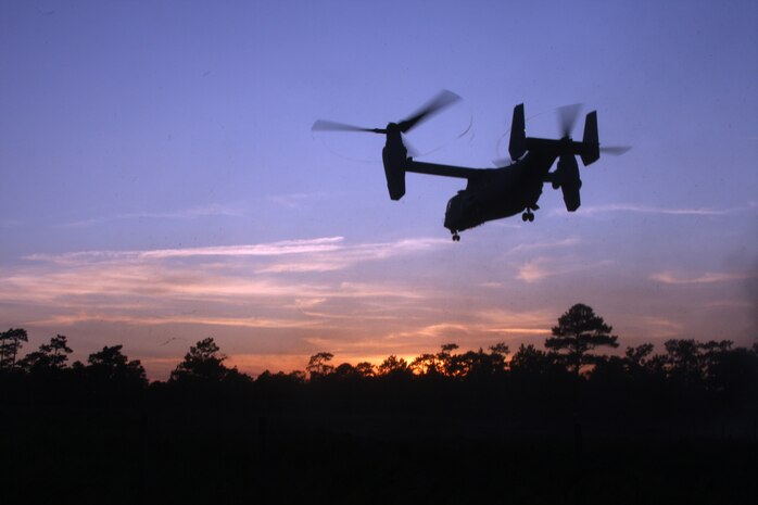 A MV-22 Osprey, from Marine Medium Tilt Rotor Squadron -162, 24th Marine Expeditionary Unit, soars into the sky, escorting Marines from Charlie Company, Battalion Landing Team 1st Battalion, 9th Marine Regiment, 24th MEU, successfully completed a company-sized raid during the Heliborne Company Raid Course at Camp Lejeune, N.C. Aug. 19.  Charlie Company trained with Special Operations Training Group to become the 24th MEU’s helo raid force for its upcoming deployment.  (U.S. Marine Corps photo by Cpl. Alex C. Guerra)