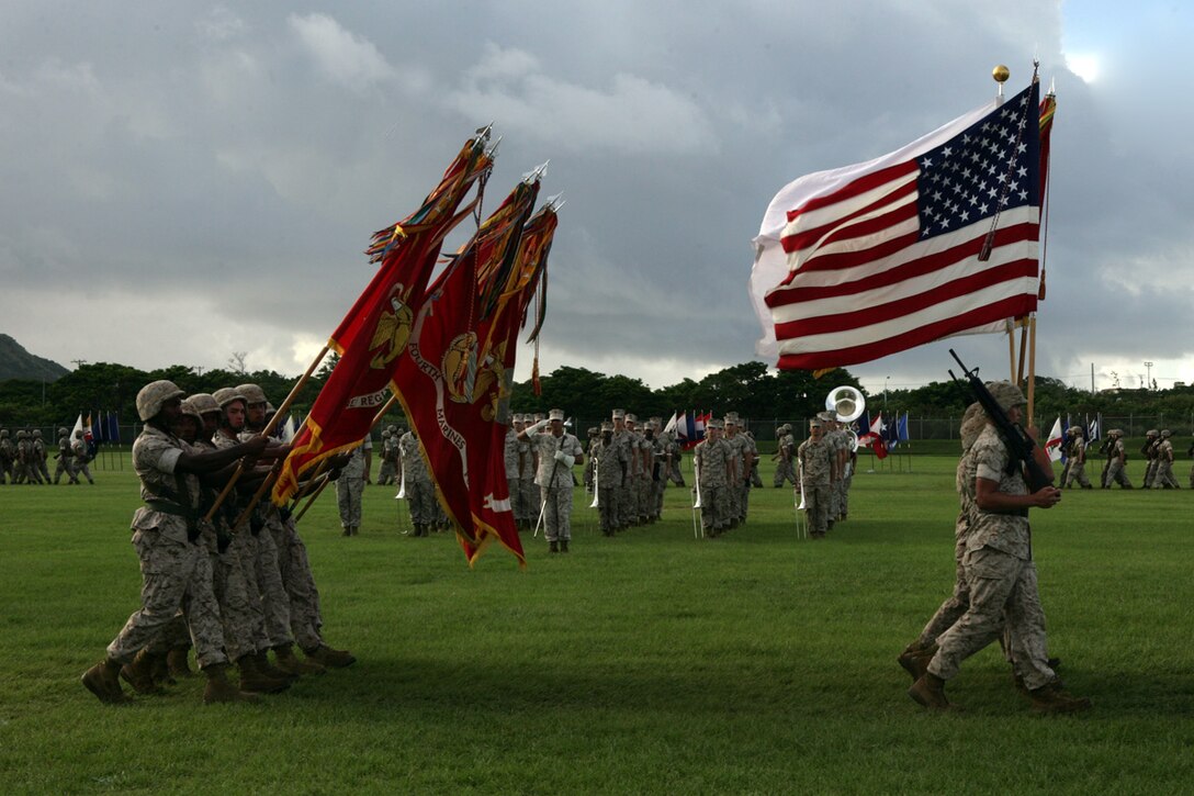 U.S. Marines with 3D Marine Division (3D Mar Div) color guard detail marches during the Pass and Review at the 3D Mar Div Change of Command Ceremony, on Camp Hansen, Okinawa, Japan, Aug. 20, 2009.  A change of command ceremony is a formal change over of duties from one commanding officer to another in the presence of the unit.  (U.S. Marine Corps photo by Cpl. John A. Chretien/Not Released)