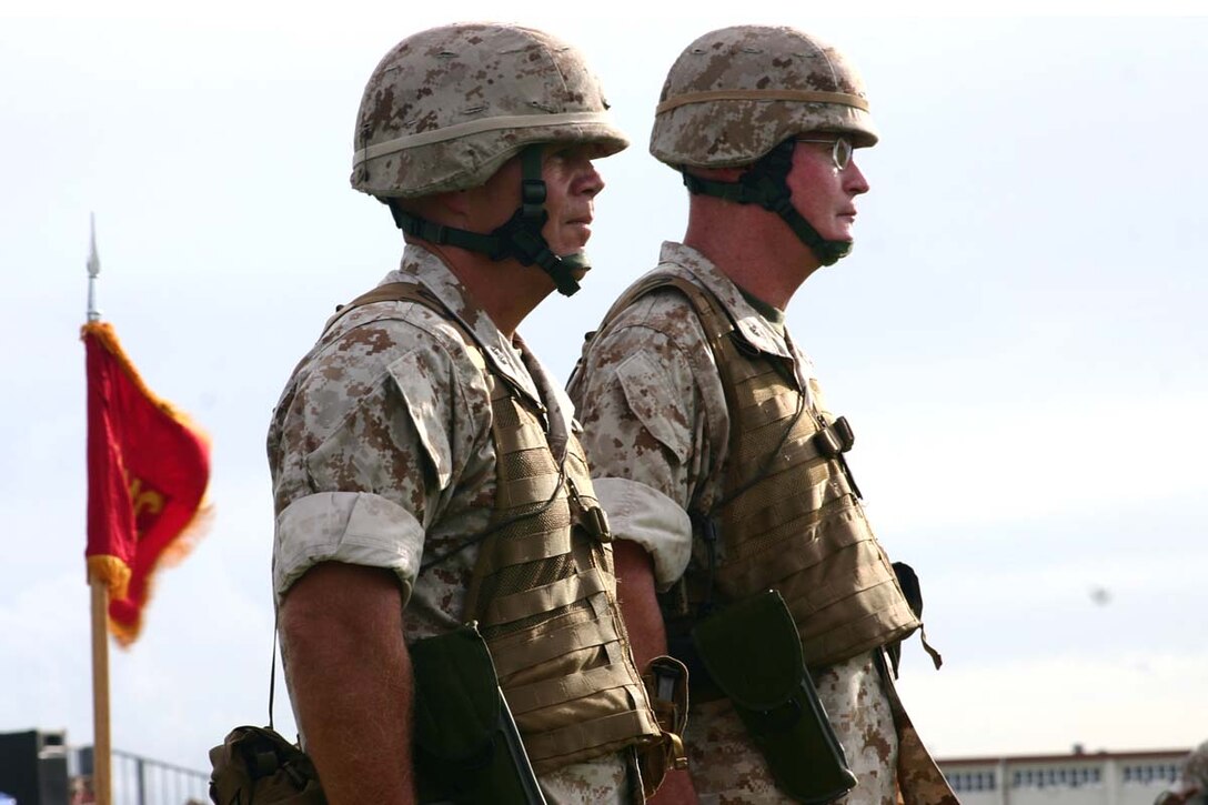 U.S. Marine Corps Maj. Gen. Robert B. Neller and Brig. Gen. James B. Laster stand at attention at the 3D Marine Division (3D MarDiv) Change of Command ceremony on Camp Hansen, Okinawa, Japan, Aug. 20, 2008. Maj. Gen. Robert B. Neller relinquishes command of 3D MarDiv to Brig. Gen. James B. Laster. (U. S. Marine Corps photo by Pfc. Lora Harter/Released)