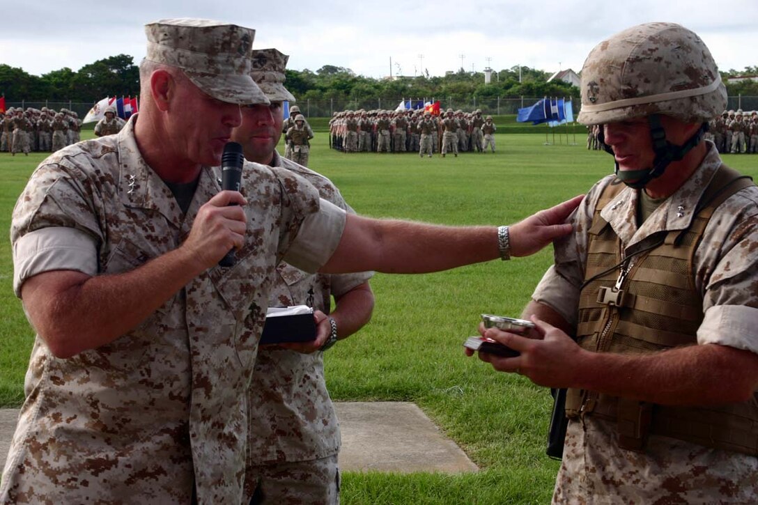 U.S. Marine Corps Lt. Gen Richard C. Zilmer presents Maj. Gen. Robert B. Neller a gift at the 3D Marine Division (3D MarDiv) Change of Command on Camp Hansen, Okinawa, Japan, Aug. 20, 2008. Maj. Gen. Robert B. Neller relinquishes command of 3D MarDiv to Brig. Gen. James B. Laster. (U. S. Marine Corps photo by Pfc. Lora Harter/Released)