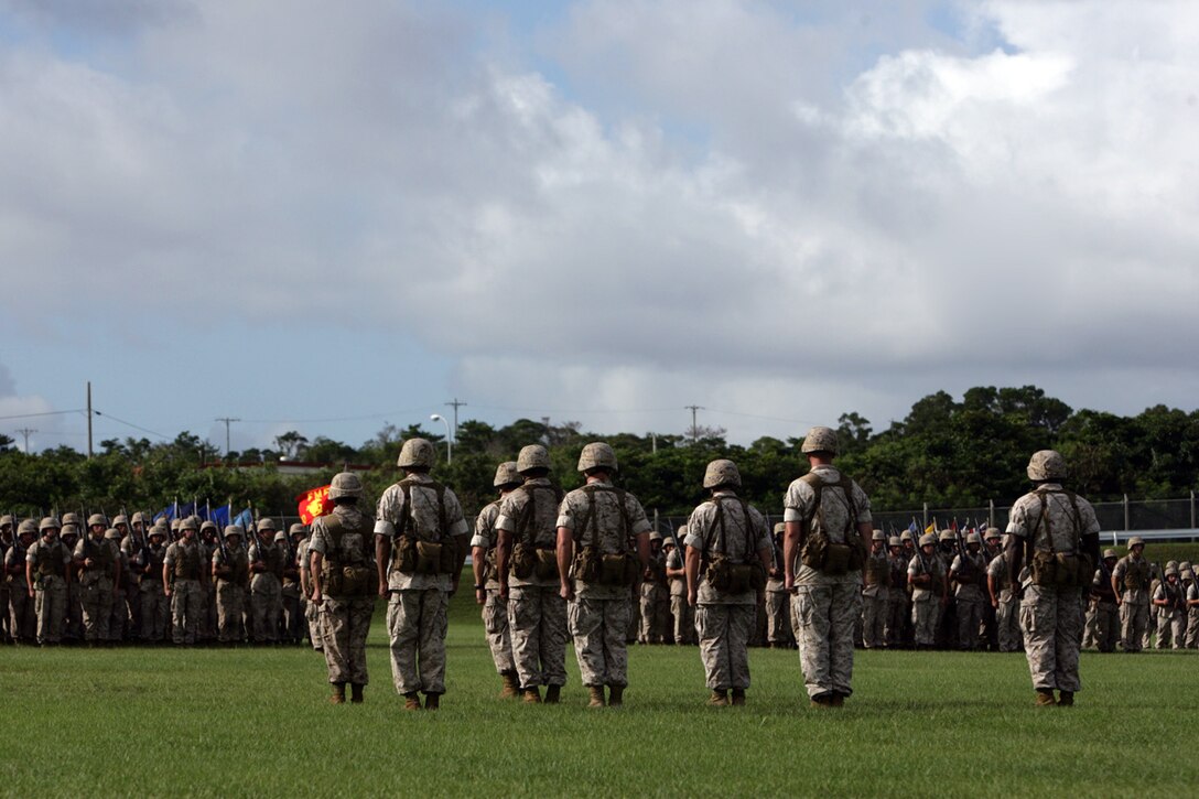 U.S. Marines with 3D Marine Division (3D Mar Div) form-up for the 3D Mar Div Change of Command Ceremony, on Camp Hansen, Okinawa, Japan, Aug. 20, 2009.  A change of command ceremony is a formal change over of duties from one commanding officer to another in the presence of the unit.  (U.S. Marine Corps photo by Cpl. John A. Chretien/Not Released)