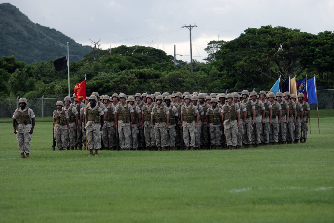 U.S. Marines with 3D Marine Division (3D Mar Div) stand in formation during the 3D Marine Division Change of Command Ceremony, on Camp Hansen, Okinawa, Japan, Aug. 20, 2009.  A change of command ceremony is a formal change over of duties from one commanding officer to another in the presence of the unit.  (U.S. Marine Corps photo by Cpl. John A. Chretien/Not Released)