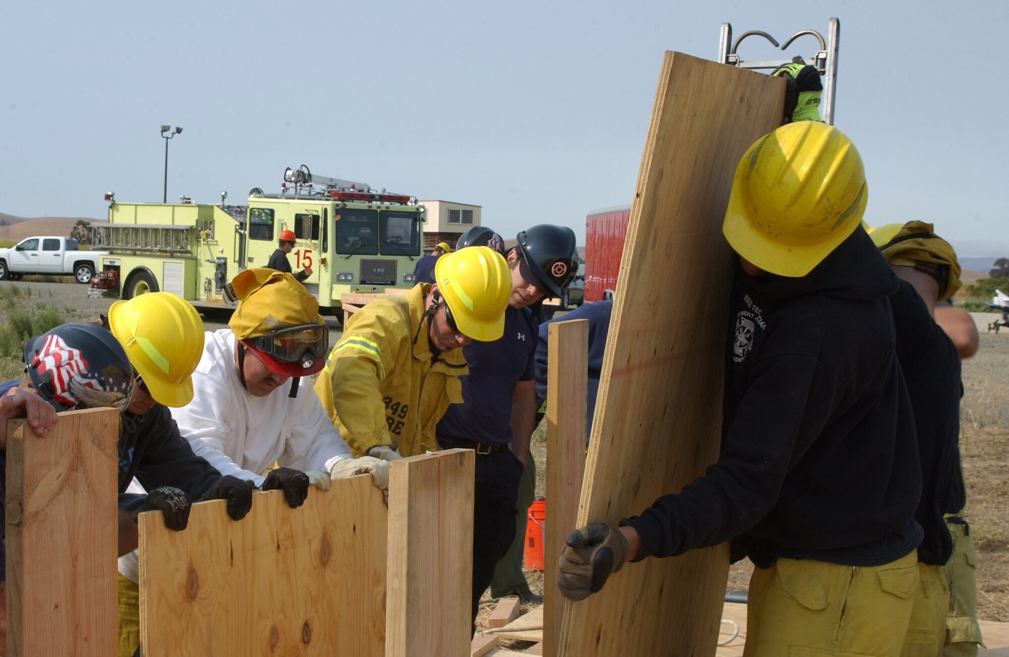 Personnel from the Travis Fire Department, install wood shoring during a trench rescue training exercise, Aug. 11. This training is designed to teach emergency responders how to operate safely around and in collapsed trenches. (U.S. Air Force photo/ Senior Airman Liliana Moreno)