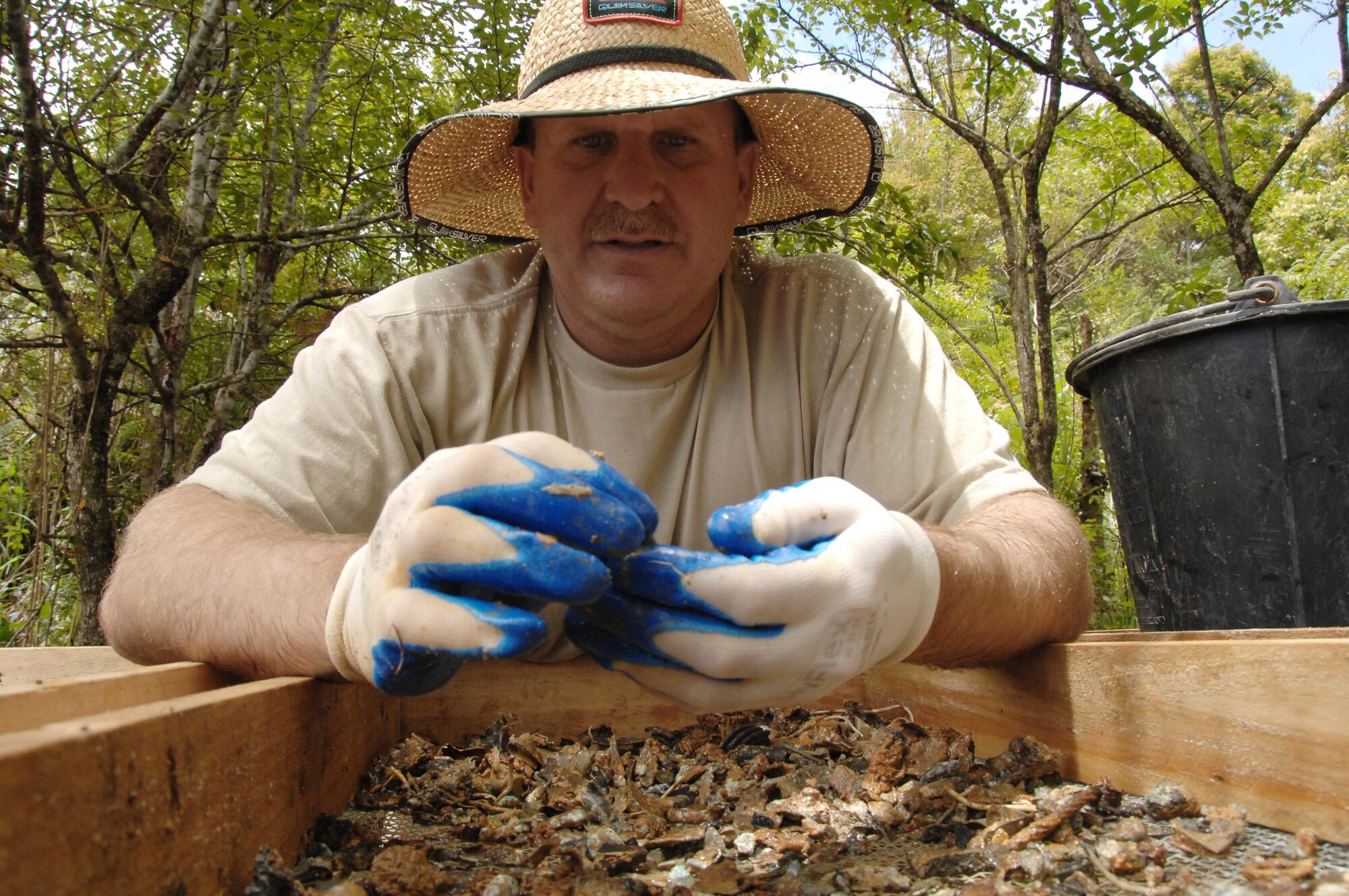 Master Sgt. Wesley Housel sifts through dirt while conducting a recent recovery mission in the Houaphan Province, Lao People's Democratic Republic. Sergeant Housel was a digger assigned to a 10-member recovery team on a 36-day deployment to Laos in an attempt to recover the remains of Americans lost during the Vietnam War. Sergeant Housel is assigned to the 437th Operations Support Squadron and was deployed in support of the Joint POW/MIA Accounting Command. (Department of Defense Photo) 
