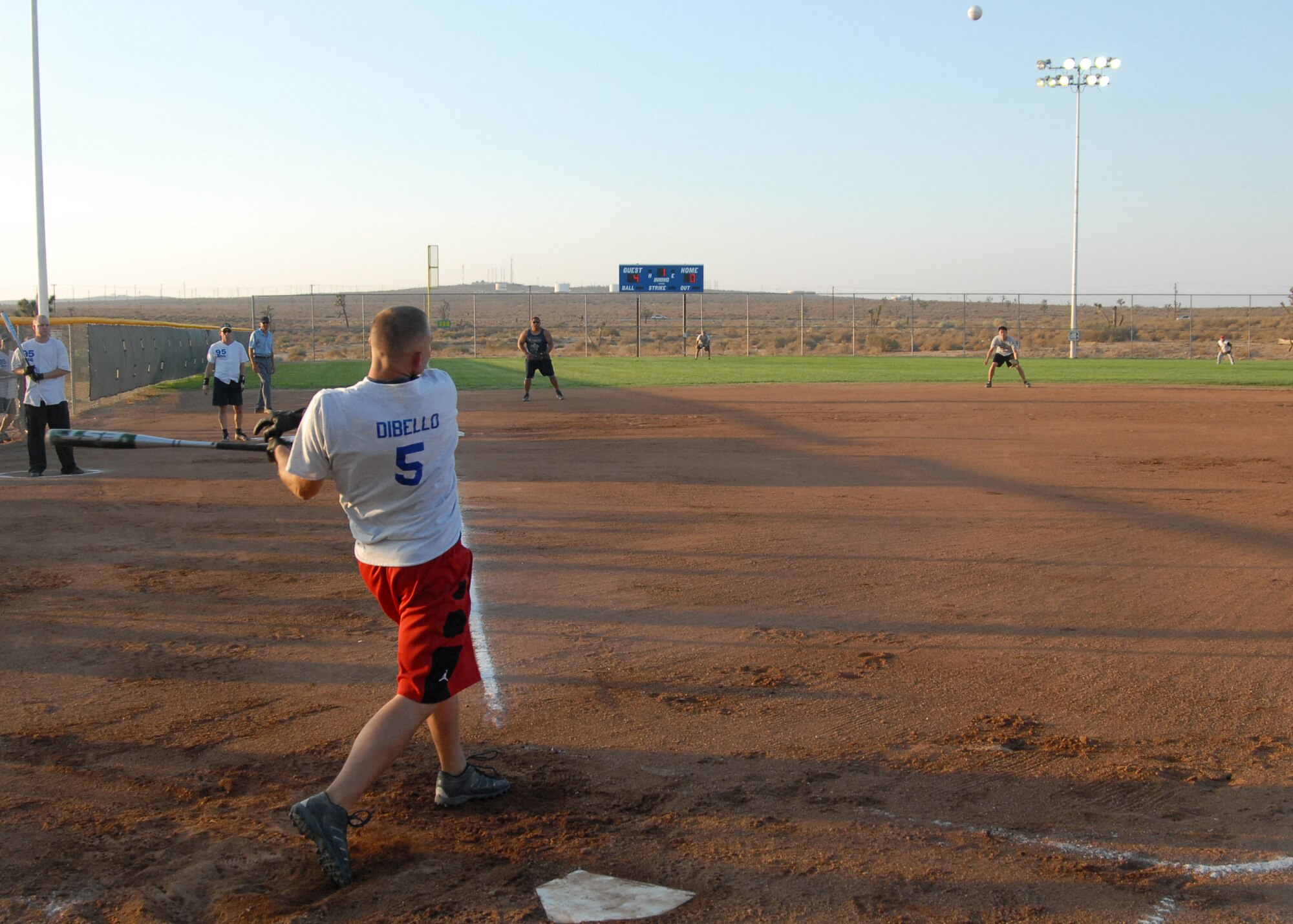 A player from the 95th Medical Operations team hits the ball during Edwards Slow Pitch Intramural Softball Championship here Aug. 18. The 95th MDG was undefeated in the playoffs and won the championship 21-15. (Air Force photo/Airman 1st Class William O'Brien)