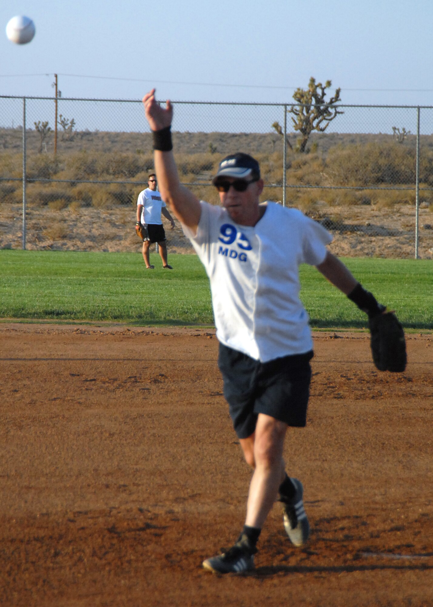 James Carpenter, 95th Medical Group pitcher, throws a pitch during the 95th MDG's Intramural Slow Pitch Softball Championship victory here Aug. 18. This championship was the 95th MDG's second consecutive. The 95th MDG won by a final score of 21-15. (Air Force photo/Airman 1st Class William O'Brien)