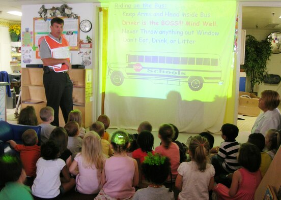 James Gregoire, 29th Test Systems Squadron, briefs children at the Eglin Child Development Center about school bus safety Aug. 19 prior to the first day of school next week.  (Courtesy photo)