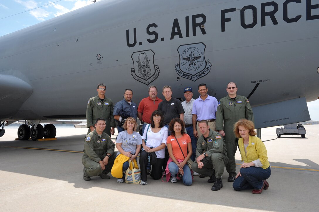 Participants in an Honorary Commander's Flight gather near the KC-135 Stratotanker they flew an aerial refueling mission in on Aug. 15. The tanker was flown by an aircrew from the 931st Air Refueling Group, an Air Force Reserve unit at McConnell Air Force Base, Kan. Second from the left in the front row is Jody Baker, principal of Meadowlard at Prairie Creek Elementary School in Derby, Kan., and honorary commander of the 931st ARG's Operations Support Flight. (U.S. Air Force photo/Tech. Sgt. Jason Schaap)