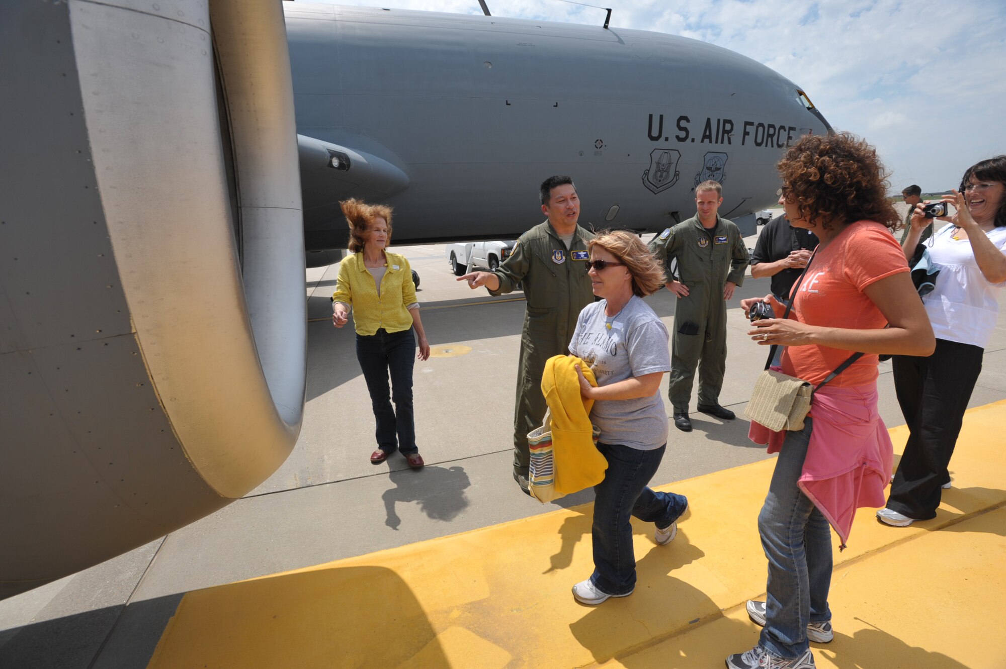 Jody Baker heads for a closer look at a KC-135 Statotanker engine parked at McConnell Air Force Base, Kan., on Aug. 15. Baker is the principal of Meadowlark at Prairie Creek Elementary School in Derby, Kan., and the honorary commander of the 931st ARG's Operations Support Flight. She and other honorary commanders of active-duty units at McConnell Air Force Base, Kan., were invited to fly with a 931st KC-135 aircrew during an aerial refueling mission on Aug. 15. (U.S. Air Force photo/Tech. Sgt. Jason Schaap)