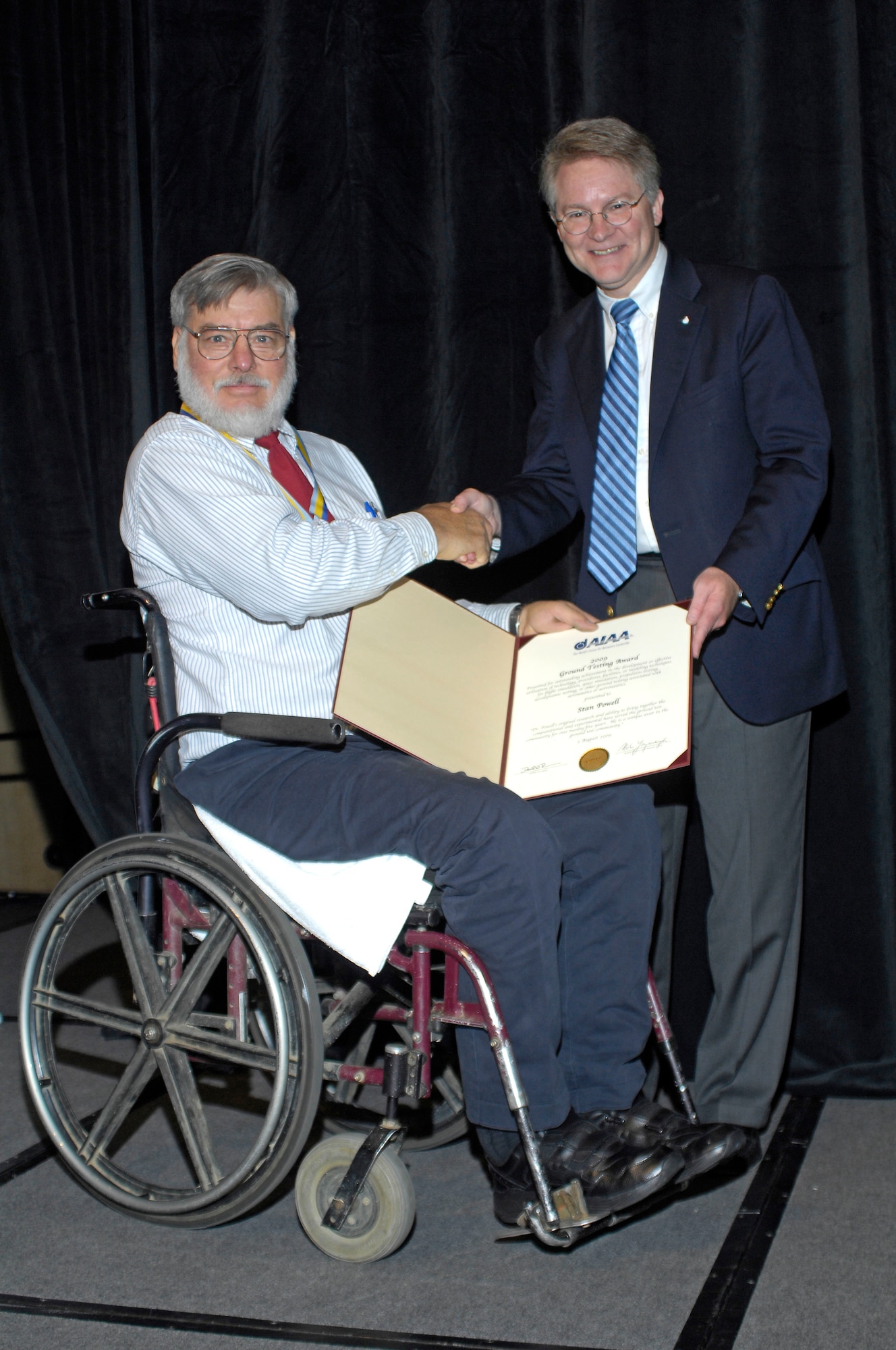 Dr. Stan Powell is presented the 2009 American Institute of Aeronautics and Astronautics (AIAA) ground test award by AIAA President David Thompson. (Photo provided)
