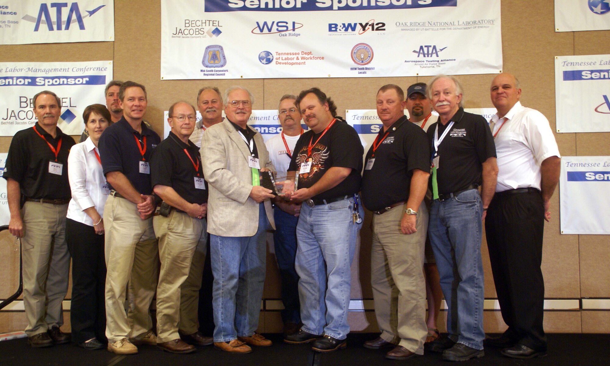 Aerospace Testing Alliance / Air Engineering Metal Trades Council (AEMTC) and Bechtel Jacobs Company LLC award recipients gathered for a group photo at the end of the three-day Tennessee Labor-Relations Conference in Nashville Aug. 14. Pictured from left are Dave Simmons, ATA’s test and facility support branch manager; Lynn Moran, ATA deputy director for facilities operation and maintenance; John Taylor, ATA/AEMTC operating engineer chief steward; Gary Casteel, ATA plant operations and maintenance branch manager; Pat Eagan, ATA support services department director; Jim Hicks, ATA/AEMTC boilermaker chief steward; Tom Quatrini, ATA labor relations branch manager; Don Porter, ATA/AEMTC electrician chief steward; Gerald Stone, ATA/AEMTC instrument technician chief steward; Heath Stewart, iron worker chief steward; Ken Gipson, teamster chief steward; David Garner, ATA/AEMTC senior machinist in the model shop’s inspection lab and past AEMTC president; and Jimmy Dale Nance, current AEMTC president. (Photo by Philip Lorenz III)
