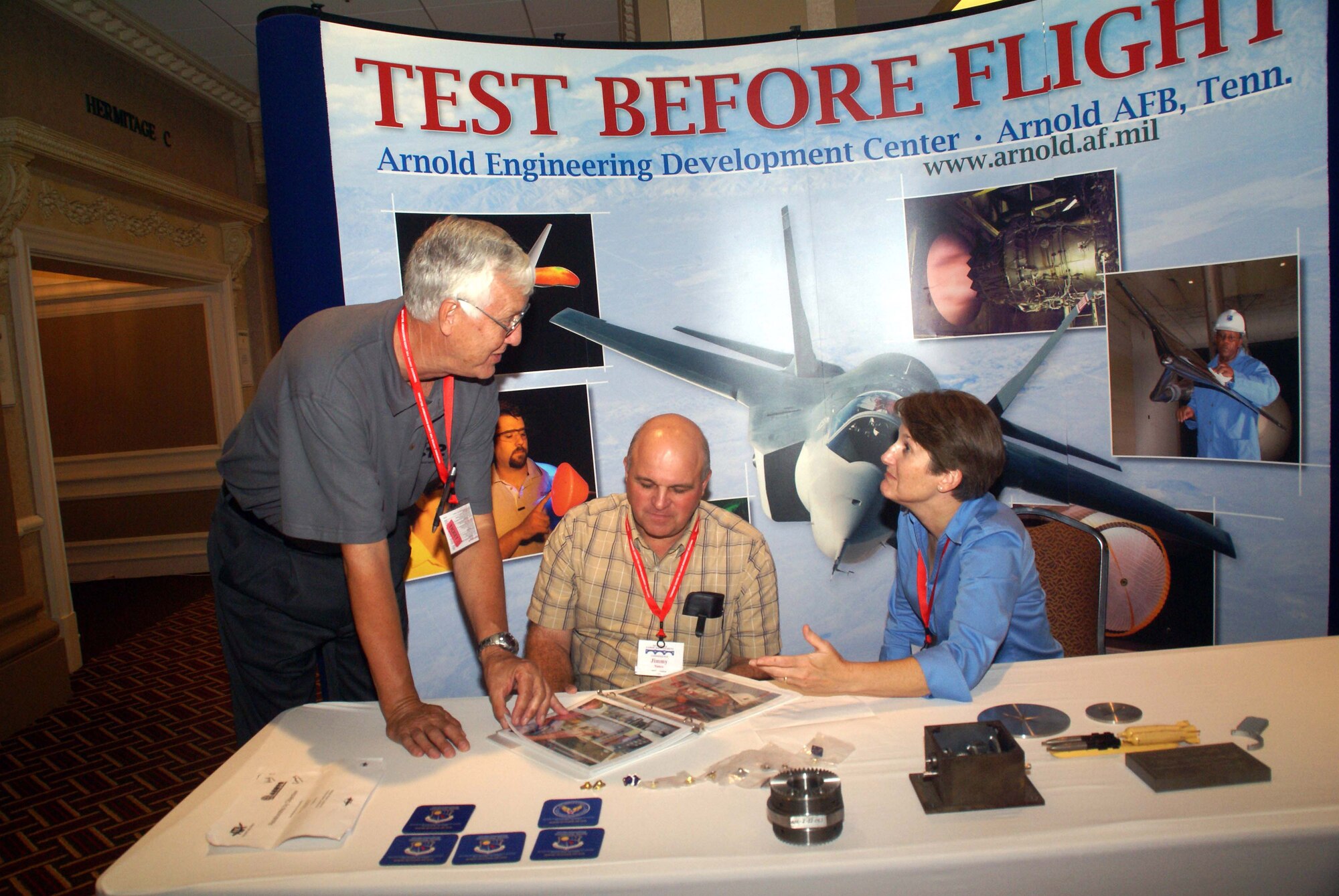Lynn Moran, Aerospace Testing Alliance (ATA) deputy director for facilities operation and maintenance, and Jimmy Dale Nance, current Air Engineering Metal Trades Council (AEMTC) president and an ATA iron worker, answer questions about Arnold Engineering Development Center from Mike Watkins, a safety representative with the Y-12 National Security Complex in Oak Ridge. (Photo by Philip Lorenz III)
