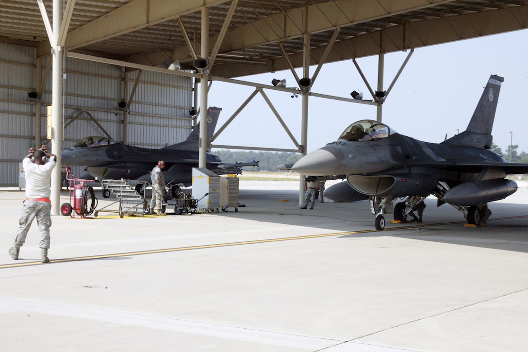 Alert F-16 Fighting Falcons are readied to roll during an alert mission exercise Aug. 11 at Shaw Air Force Base, S.C. The exercise provided training for the alert maintenance crew and pilots for real-world situations. (U.S. Air Force photo/Staff Sgt. John Gordinier) 