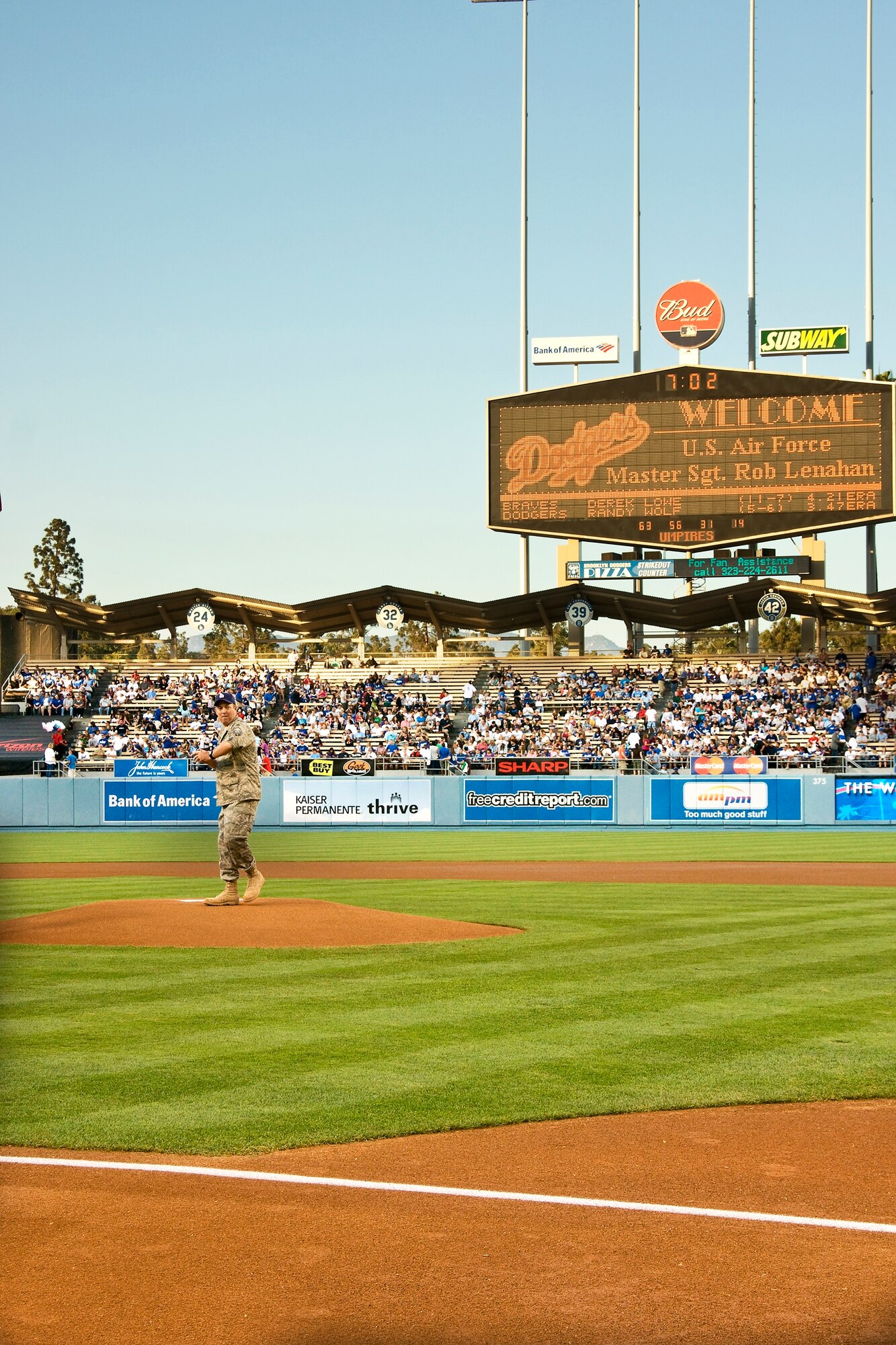 Master Sgt. Robert Lenahan, 60th Operations Support Squadron, throws out the first pitch at a Los Angeles Dodgers game Aug. 6.  Sergeant Lenahan was chosen to throw out the first pitch after he sent a photo he took of former LA Dodgers manager, Tommy Lasorda, to the LA Times newspaper after Mr. Lasorda toured his forward-deployed base. (U.S. Air Force photo/Mark Lesch)