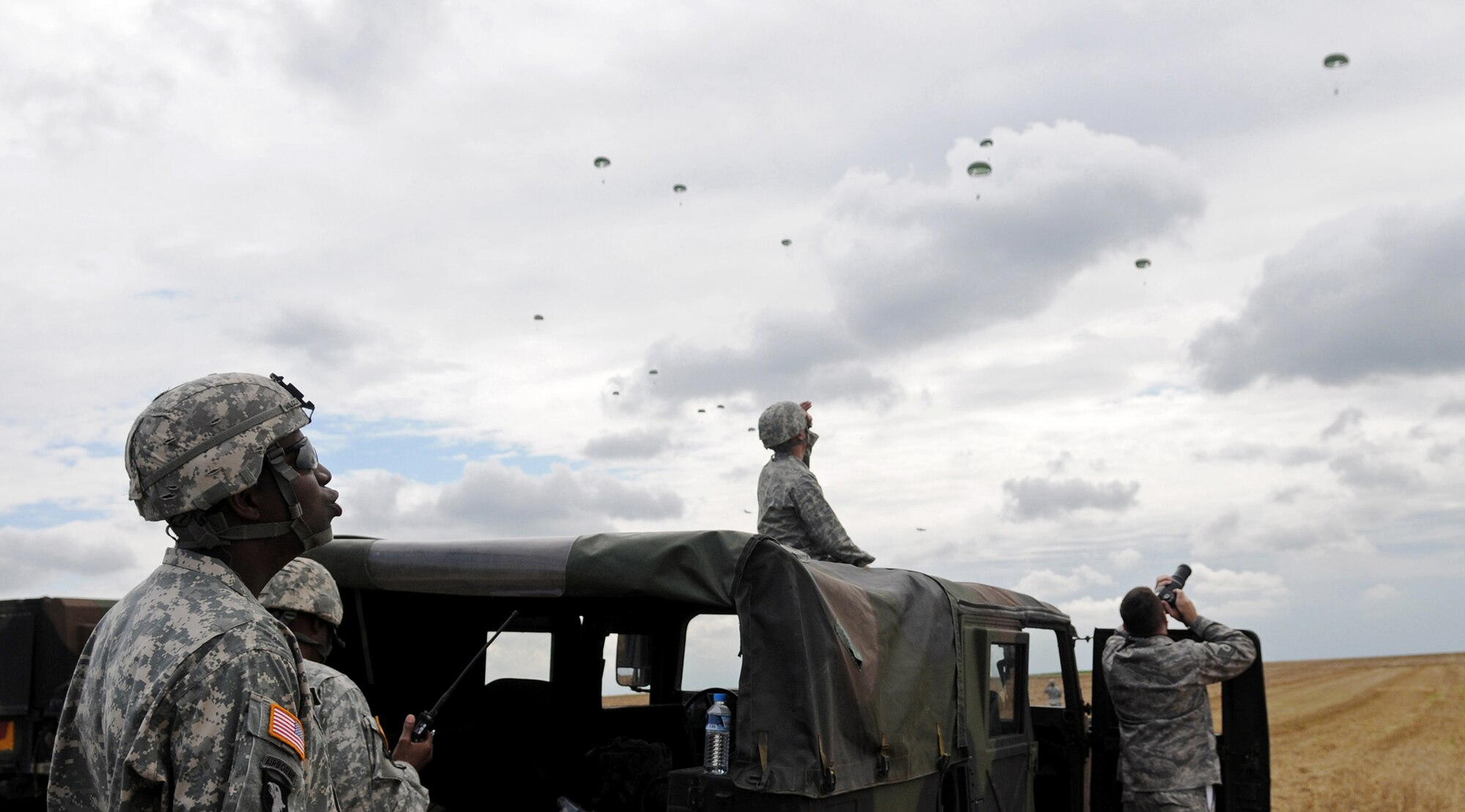 U.S. Forces along with German, Italian, Belgium and Dutch army parachute over the Bunker drop zone Aug. 13 in southwestern, Germany. U.S. soldiers and Airmen performed a combined airborne drop with four other NATO countries. (U.S. Air Force photo/Airman 1st Class Grovert Fuentes-Contreras)