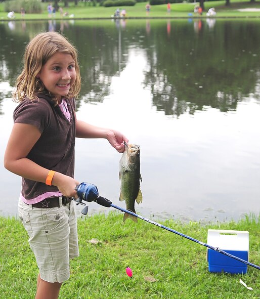 Madison Tallarida, daughter of Senior Master Sgt. Dominick Tallarida, 911th Air Refueling Squadron, reeled in a 1.09 pound largemouth bass at the fishing derby at Seymour Johnson Air Force Base, N.C., Aug. 16, 2009. Madison, age 9, won her age group by catching the largest fish. (U.S. Air Force photo by Airman 1st Class Rae Perry)