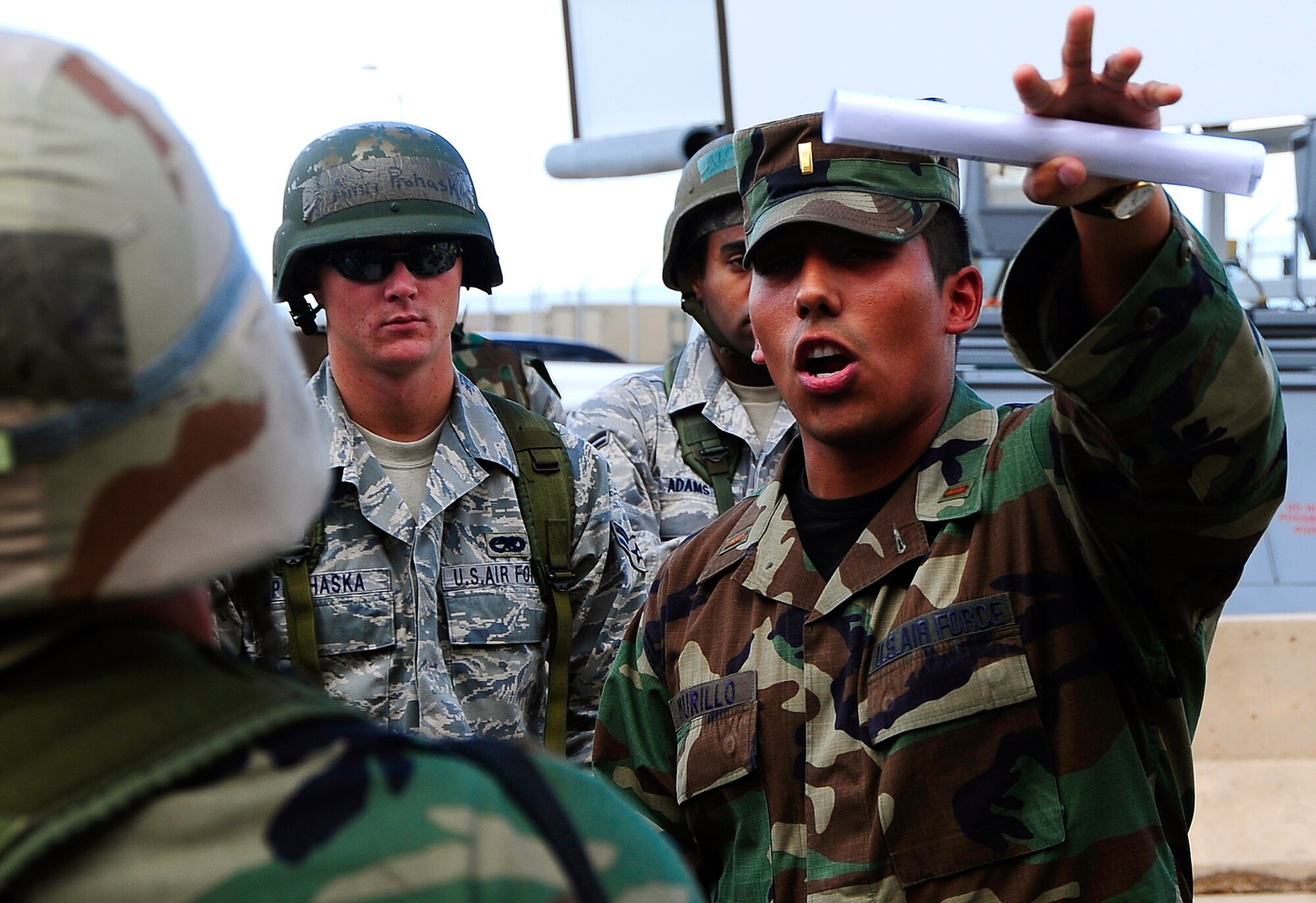HOLLOMAN AIR FORCE BASE, N.M. -- 2nd Lt. Jesse Murillo of the 49th Force Support Squadron gives direction to Airmen From the 49th Aircraft Maintenance Squadron during a Phase I Operations Readiness Exercise here Aug. 18. (U.S. Air Force photo by Tech. Sgt. Chris Flahive)