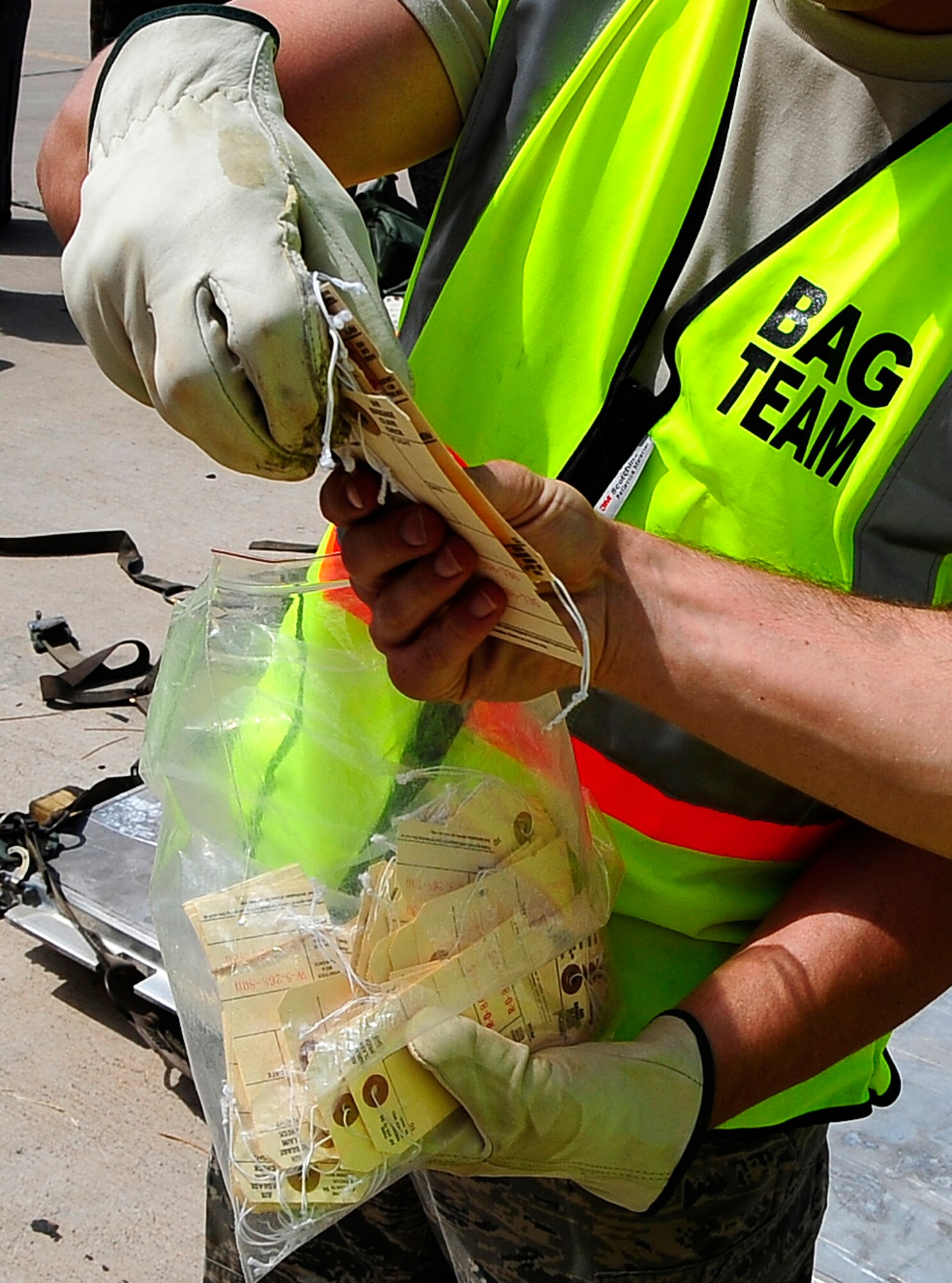 HOLLOMAN AIR FORCE BASE, N.M. -- Airmen from the 49th Logistics Readiness Squadron participate in a Phase I Operational Readiness Exercise and hand out bag tags here Aug. 18. (U.S. Air Force photo by Tech. Sgt. Chris Flahive)