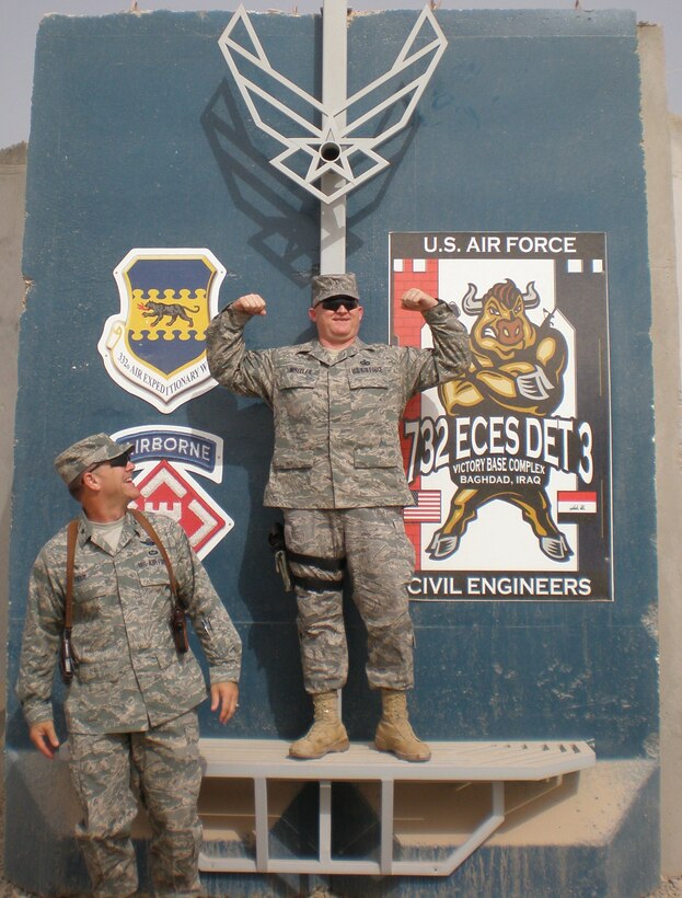 Chief Master Sgt. Paul Wheeler (right) and Chief Master Sgt. David Nordel, (left) posing near a fortification on Joint-Base Balad, Iraq. (Photo Courtesy of Chief Nordel)