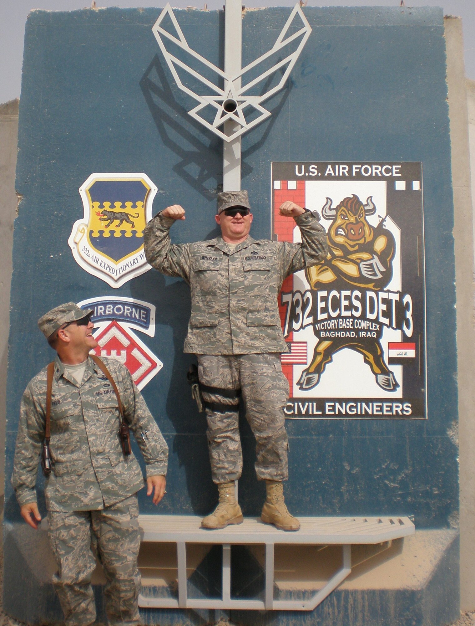 Chief Master Sgt. Paul Wheeler (right) and Chief Master Sgt. David Nordel, (left) posing near a fortification on Joint-Base Balad, Iraq. (Photo Courtesy of Chief Nordel)
