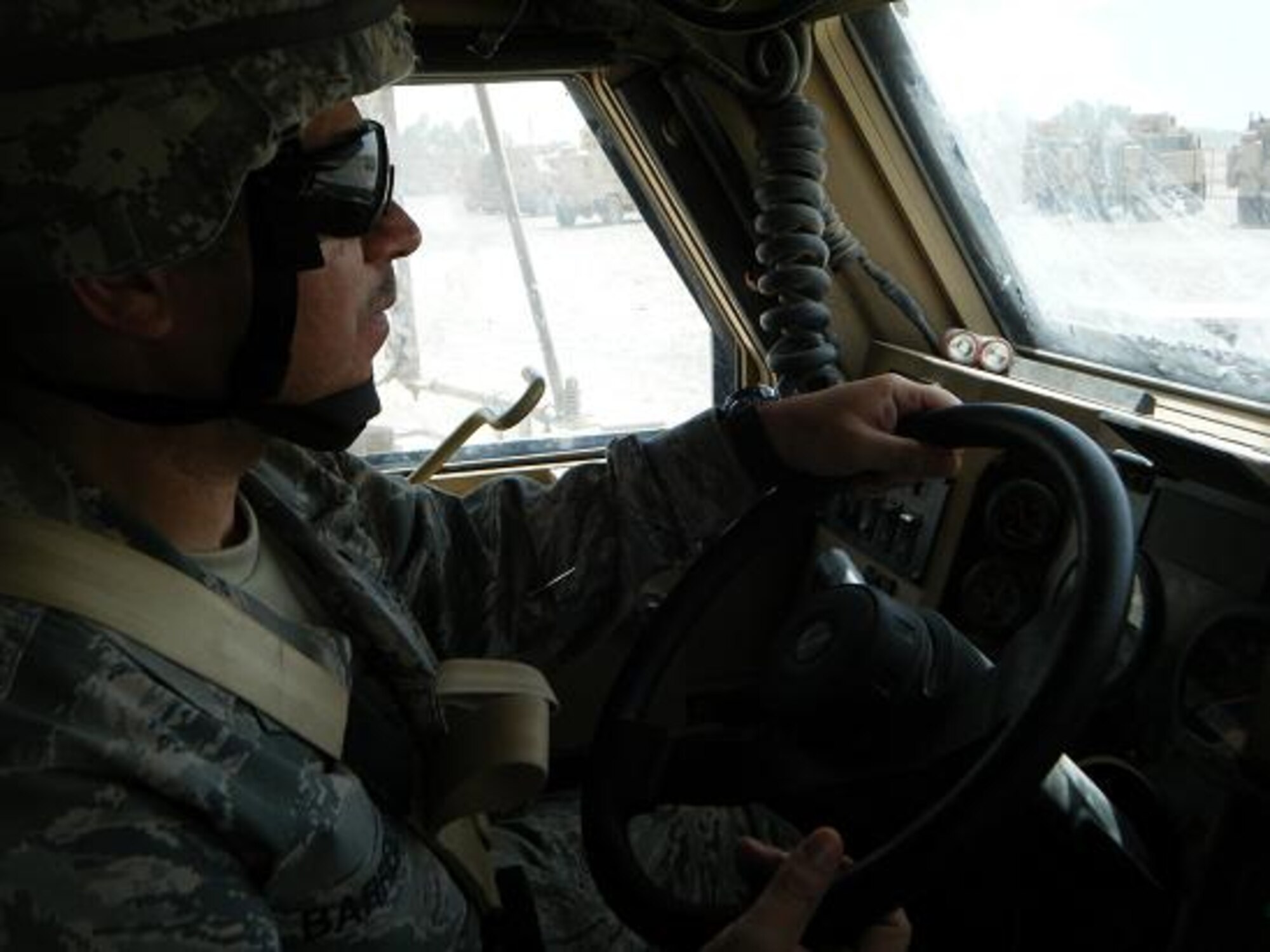 Master Sgt. Roger Barrientos, 332nd Expeditionary Communications Squadron, goes through a Mine Resistant Ambush Protected, or MRAP, at Joint Base Balad, Iraq. Sergeant Barrientos is currently deployed from the 944th Fighter Wing where he works as a workgroup manager. (Courtesy photo)
