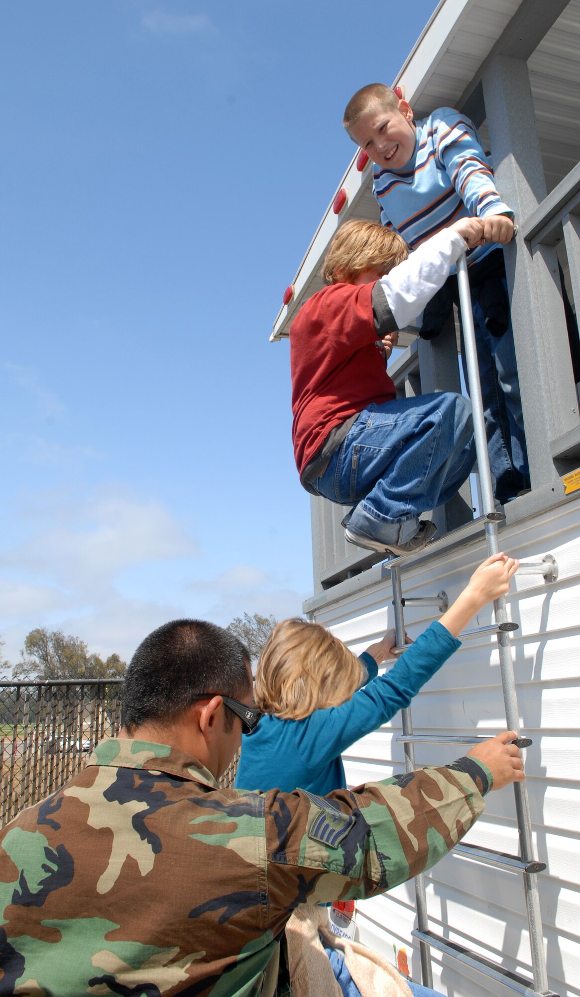 VANDENBERG AIR FORCE BASE, Calif. -- During a simulated house fire, attendees of the Kids’ Fire Camp learned the procedures for exiting a burning home Aug. 15 at Fire Station 2 here. The children were taught how to check for fire hazards, call 911, “stop, drop and roll,” and exit a burning home. (U.S. Air Force photo/Airman 1st Class Kerelin Molina)