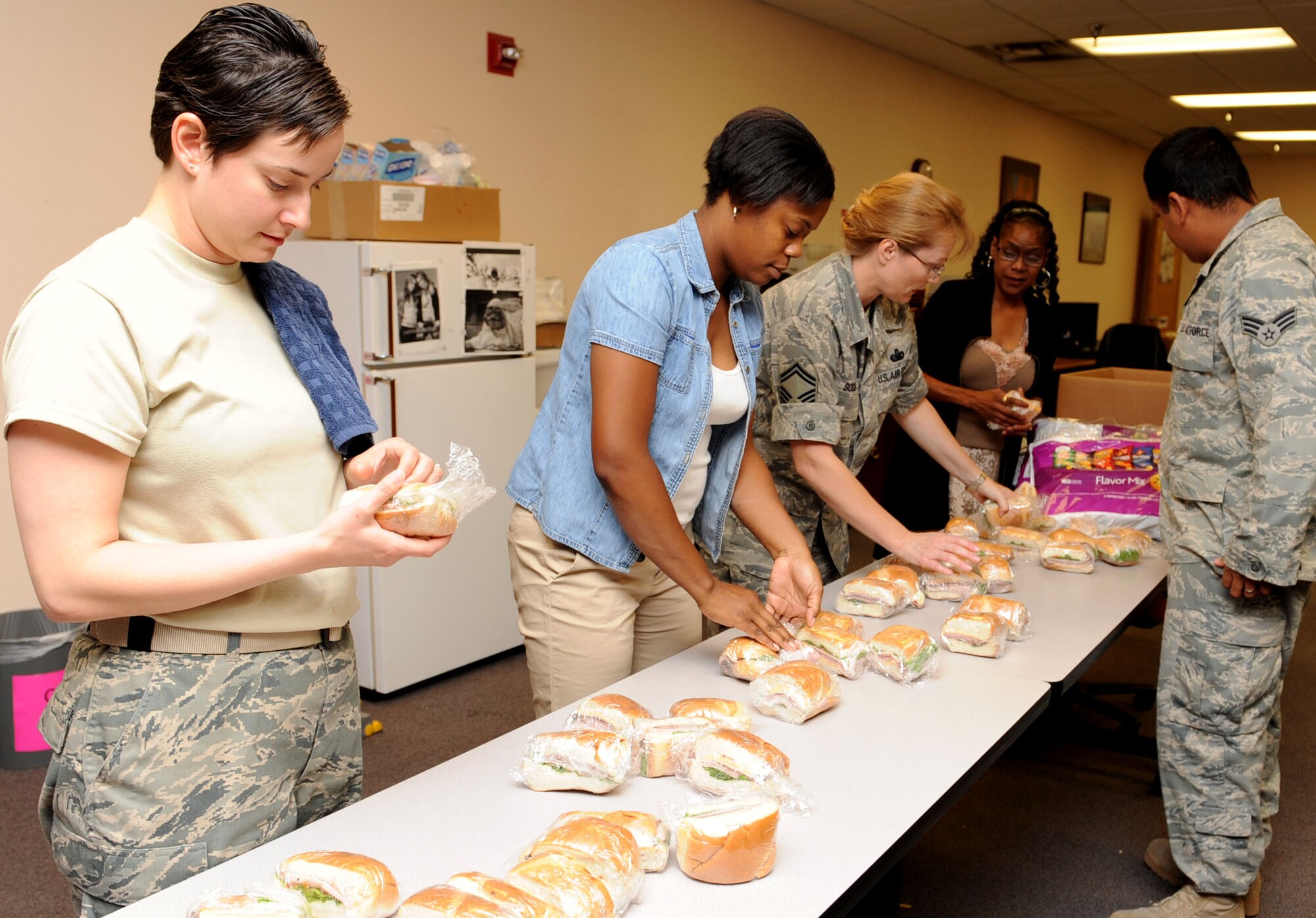 Personnel from the 49th Logistics Readiness Squadron prepare sandwiches for personnel working at the 49th LRS Deployment Control Center here Aug. 19. Drinks and cookies were also taken out to the various personnel from 49th LRS, 49th Force Support Squadron and 49th Material Maintenance Group. (U.S. Air Force photo by Senior Airman Rachel Kocin)