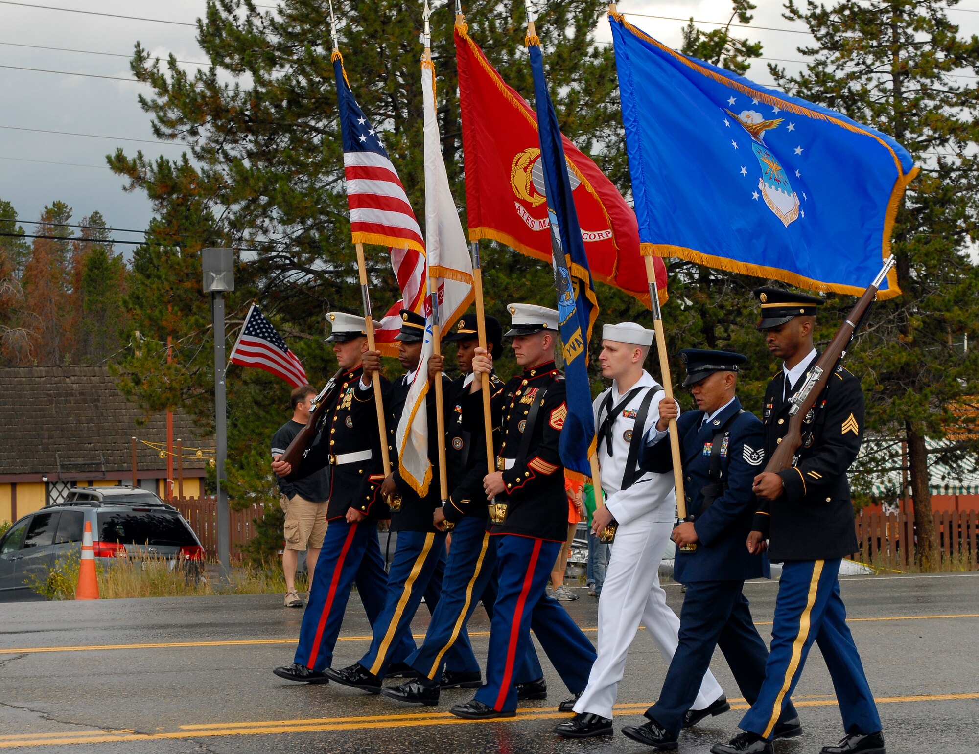 NORAD U.S. Northern Command Joint Color Guard members march with the colors during the Salute to American Veterans Rally and Festival parade in Winter Park, Colo., Aug. 15. Each service was represented at the rally. (U.S. Air Force photo by Senior Airman Stephen Musal)