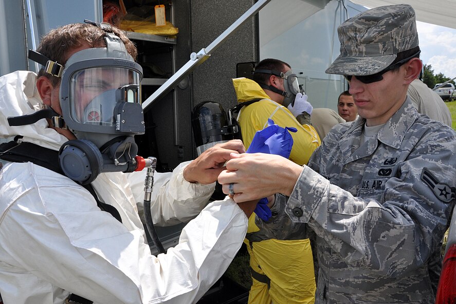 EGLIN AIR FORCE BASE, Fla. – Airman 1st Class Nick Graham, 96th Civil Engineer Group Explosive Ordinance Disposal, gears up during a nuclear accident response exercise here, Aug. 18. The NARE put Eglin’s readiness to the test after a simulated C-17 Globemaster declared an in-flight-emergency and subsequently crashed with 10 people and a special weapon on board. These exercises maintain readiness for Eglin’s emergency responders, follow-on forces and maintain qualifications of command and control personnel. During the exercise, agencies had the opportunity to work with other Eglin units they don’t train with regularly. (U.S. Air Force photo/ Airman Anthony Jennings)