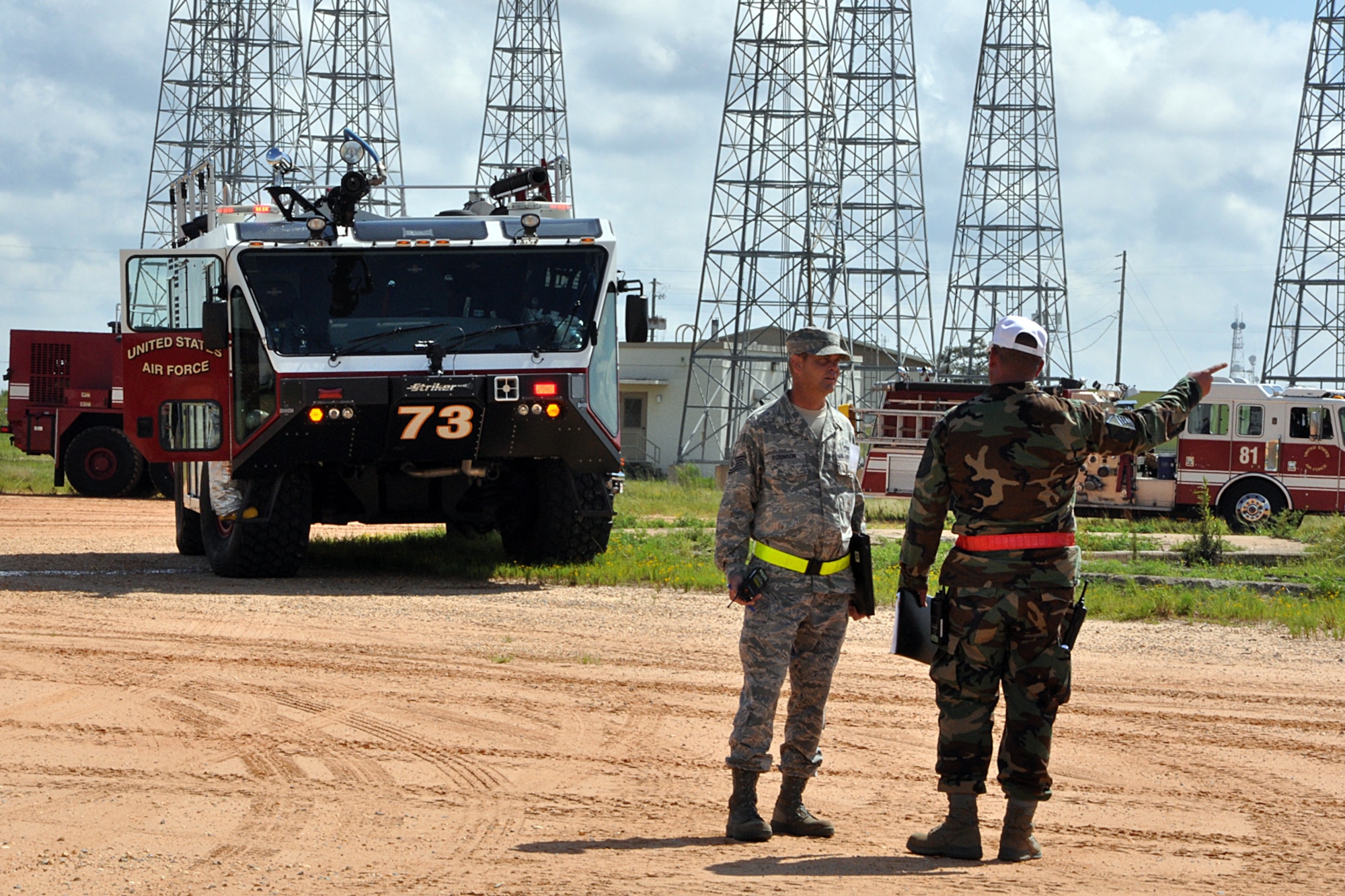 EGLIN AIR FORCE BASE, Fla. – Tech. Sgt. Mark Robinson, exercise director, and Master Sgt. Darry Childs, Exercise Evaluation Team chief, discuss plans at a simulated crash site during a nuclear accident response exercise here, Aug. 18. The NARE put Eglin’s readiness to the test after a simulated C-17 Globemaster declared an in-flight-emergency and subsequently crashed with 10 people and a special weapon on board. These exercises maintain readiness for Eglin’s emergency responders, follow-on forces and maintain qualifications of command and control personnel. During the exercise, agencies had the opportunity to work with other Eglin units they don’t train with regularly. (U.S. Air Force photo/ Airman Anthony Jennings)