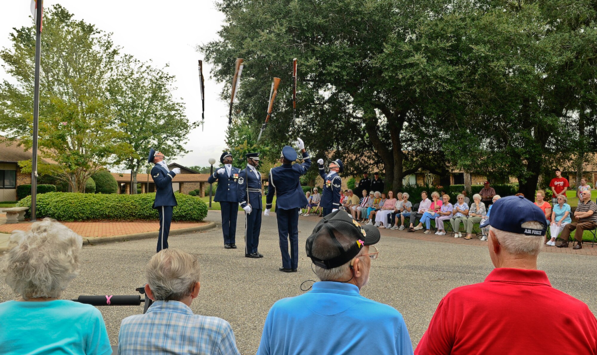 United States Air Force Honor Guard Drill Team members throw their 11-pound M-1 Garand rifle during a four-man performance at the Bob Hope Village in Shalimar, Fla., on Aug. 18. The Drill Team is the traveling component of the Honor Guard and tours worldwide representing all Airmen while showcasing Air Force precision. (U.S. Air Force photo by Senior Airman Alexandre Montes)