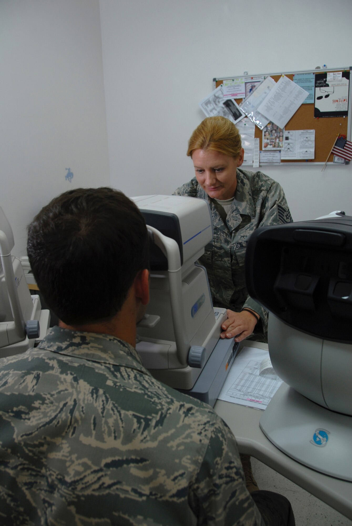 Tech. Sgt. Sarah Fry, 379th Expeditionary Medical Group ophthalmic technician, administers a visual acuity test to a patient, Aug. 20. The optometry clinic provides routine exams and emergency eye care services to deployed servicemembers at this undisclosed location in Southwest Asia. Sergeant Fry is a native of Cheyenne, Wyo., and is deployed from the Wyoming Air National Guard in support of Operations Iraqi and Enduring Freedom.  (U.S. Air Force Photo/Tech. Sgt. Jason W. Edwards)